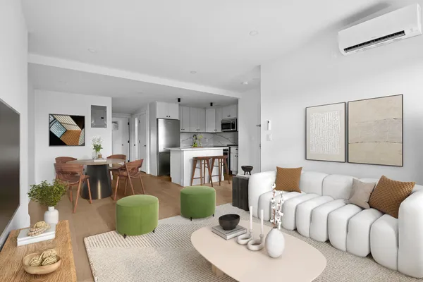 a living room with furniture a dining table and a fireplace