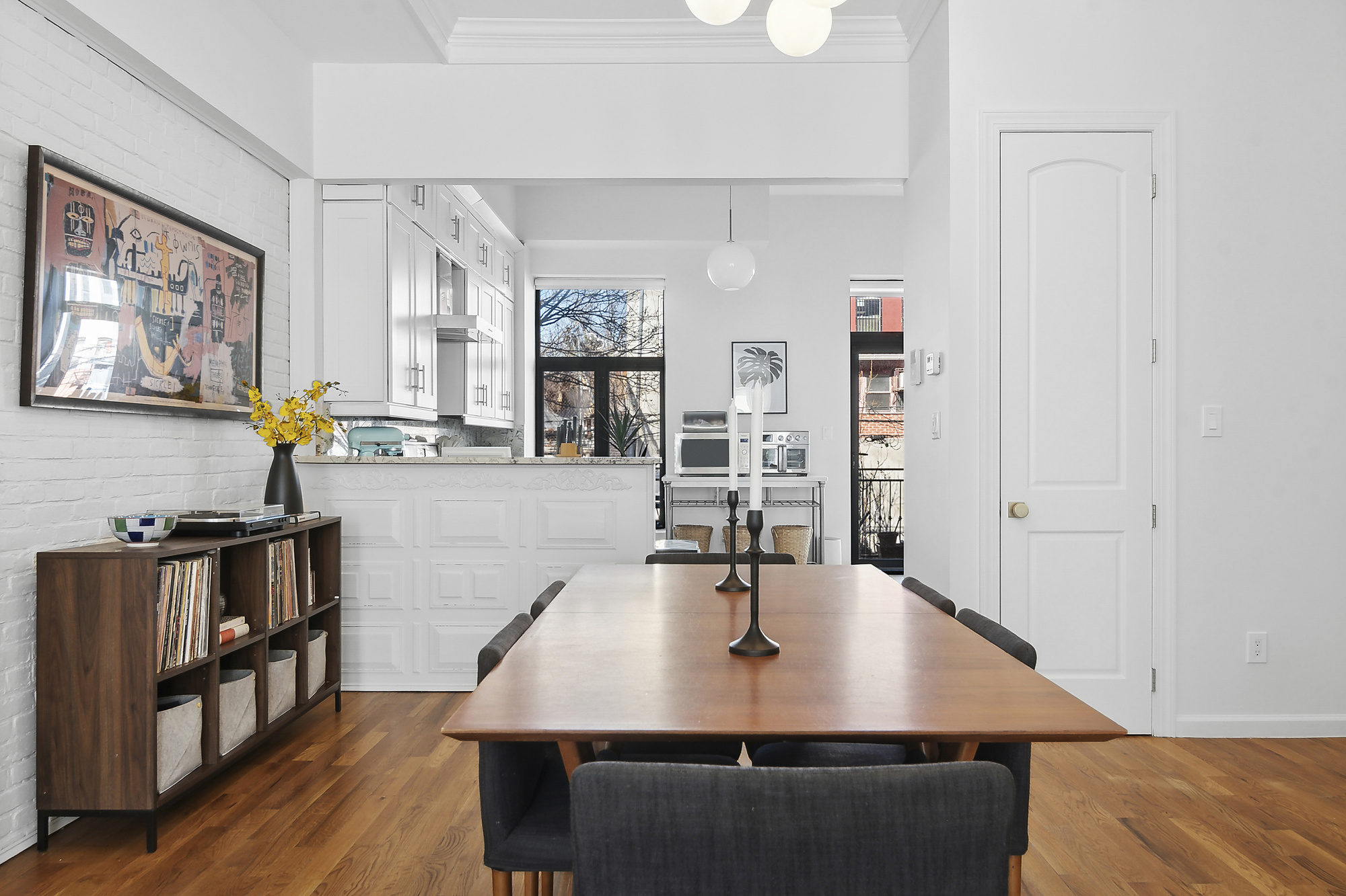 147 Herkimer Street Brooklyn, NY 11216 - Photo 5 of 25 a dining room with wooden floor and large windows