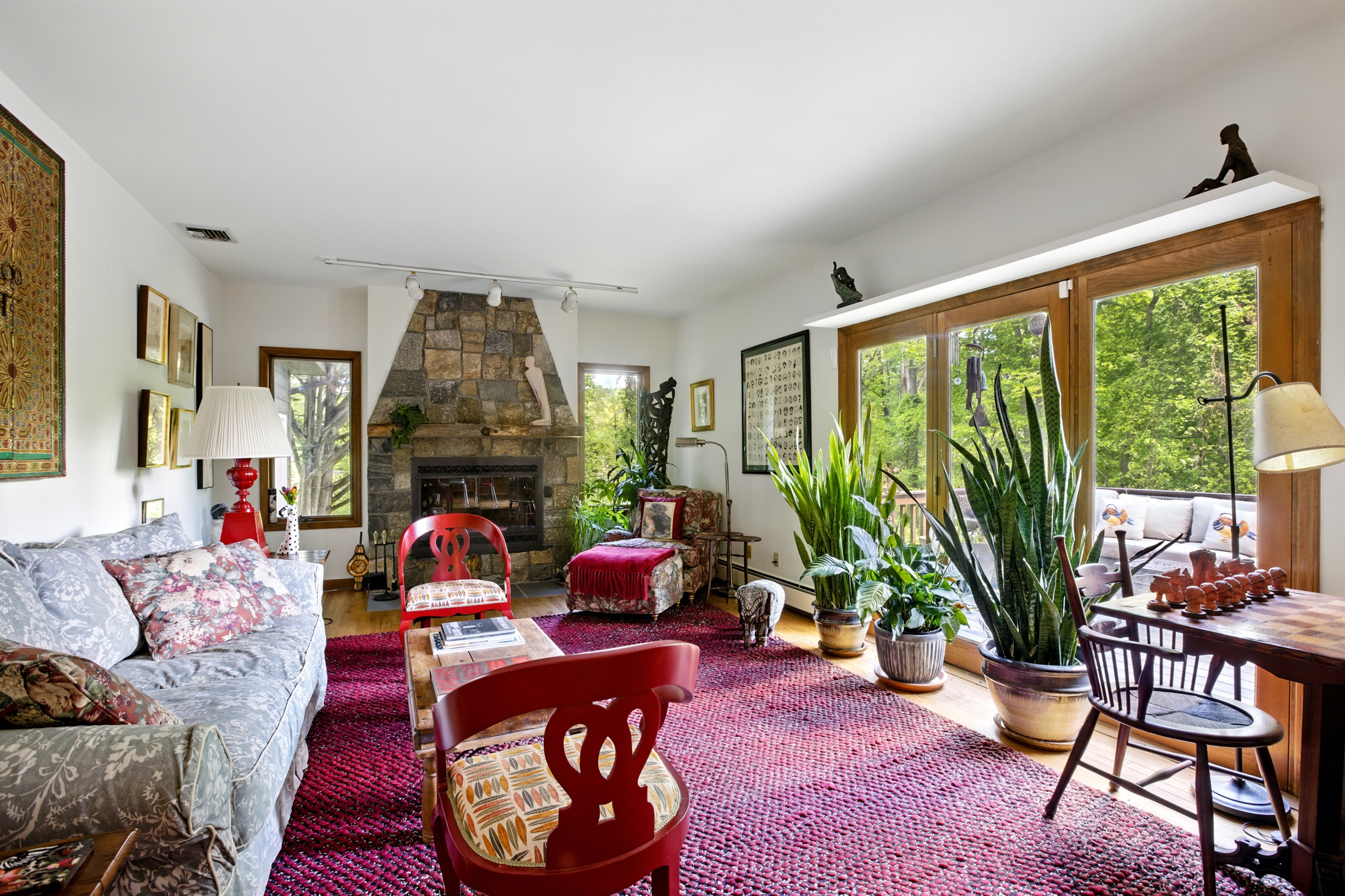19 Pond Road Cold Spring, NY 10516 - Photo 11 of 32 a living room with furniture a fireplace and a large window