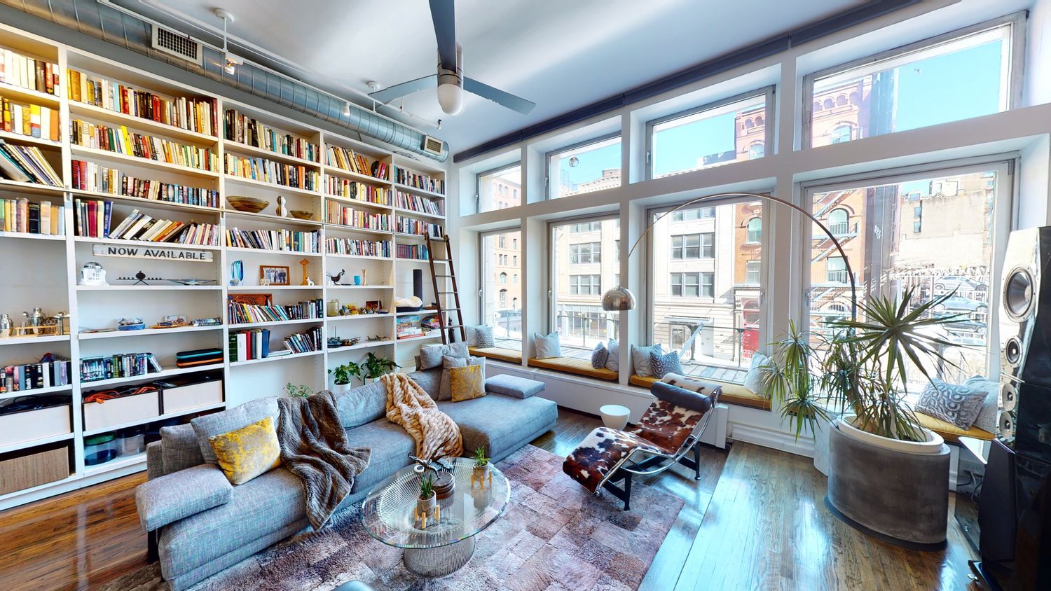 382 Lafayette Street, Unit 2 Manhattan, NY 10003 - Photo 2 of 19 a living room filled with furniture and a potted plant
