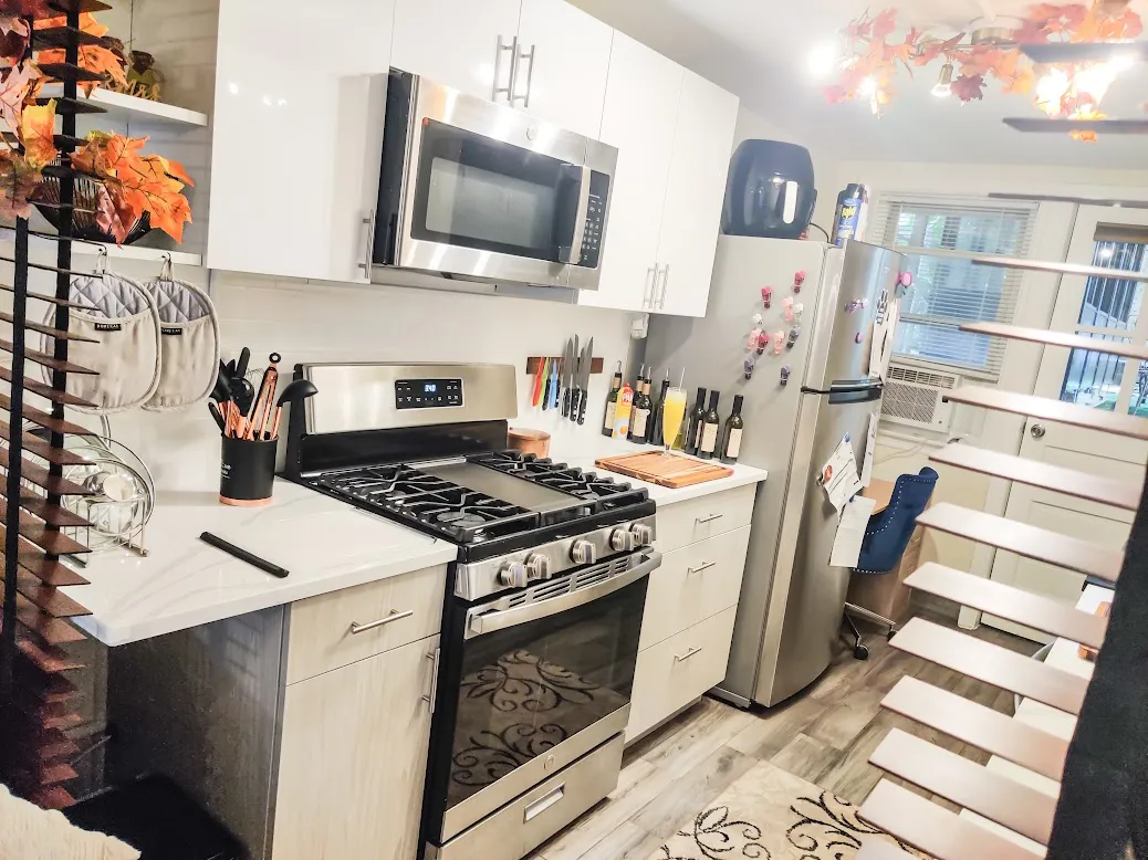 a kitchen with stainless steel appliances granite countertop a stove and a sink