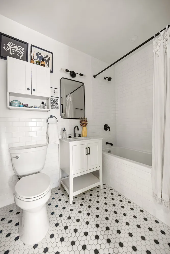a bathroom with a toilet a sink and bathtub