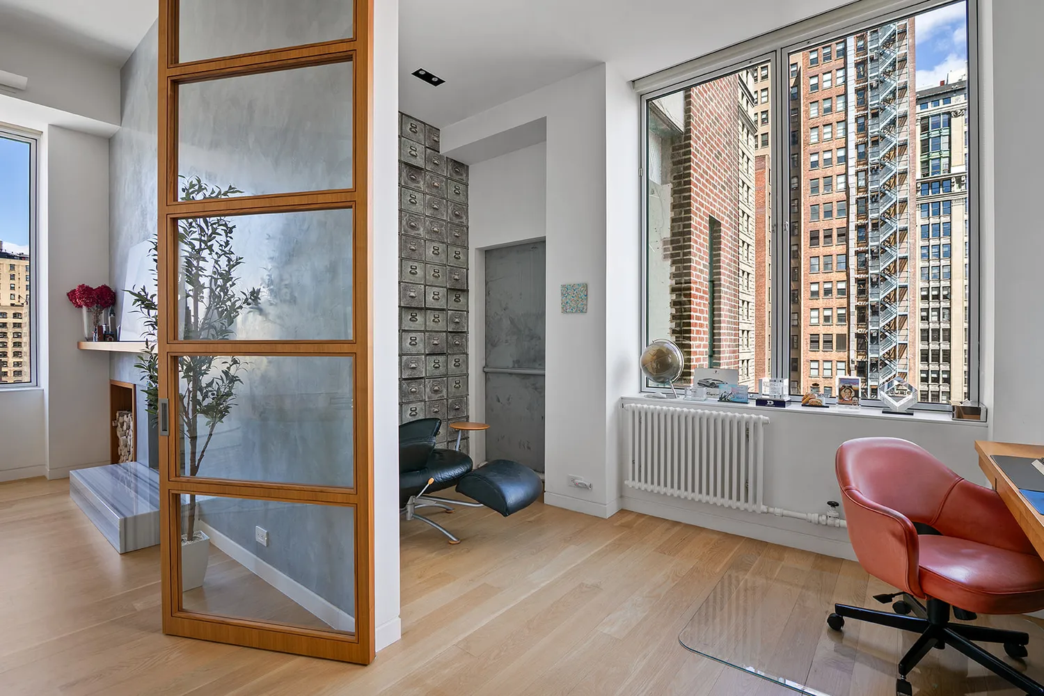 a view of a room with furniture and windows