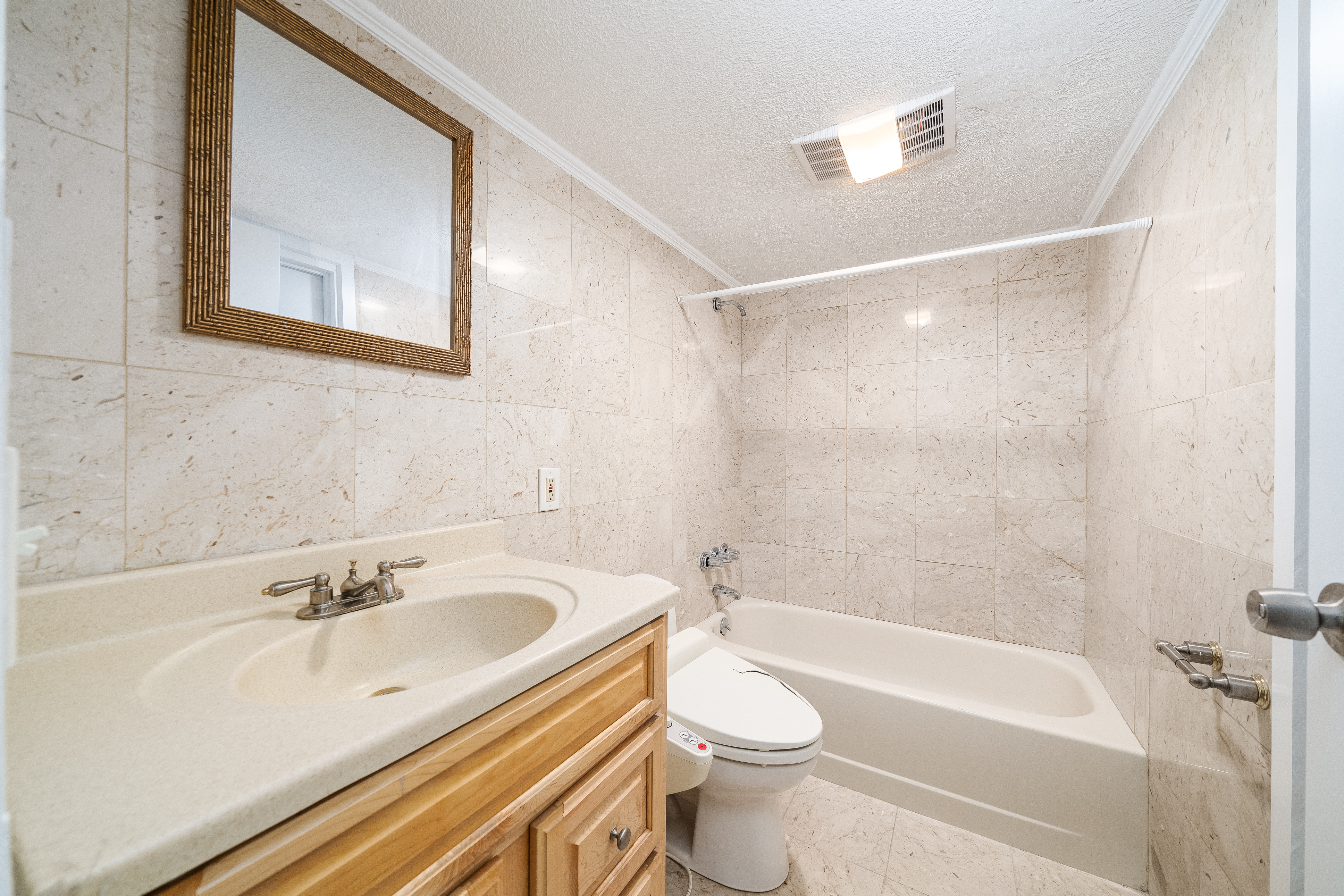 168 Coles Street, Unit BA Jersey City, NJ 07302 - Photo 11 of 29 a bathroom with a sink a toilet and a bathtub