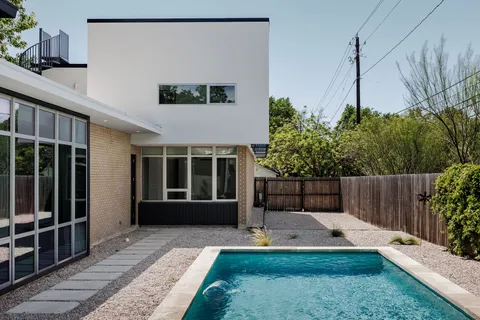 a backyard of a house with lots of green space