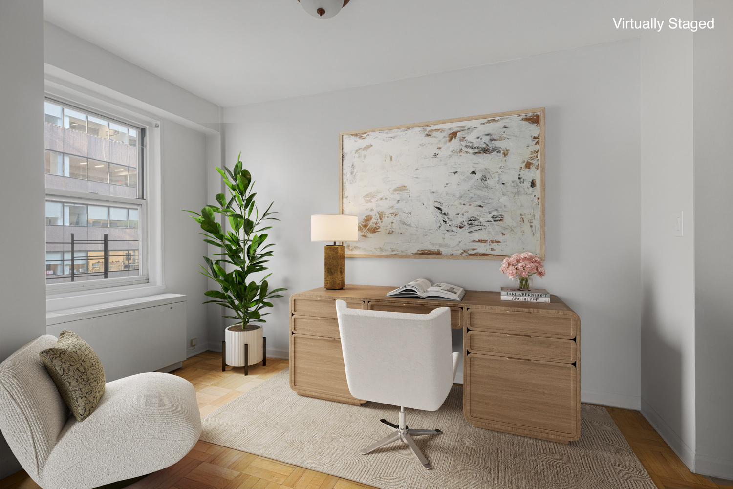 136 East 56th Street, Unit 9J Manhattan, NY 10022 - Photo 4 of 14 a workspace with furniture and a potted plant