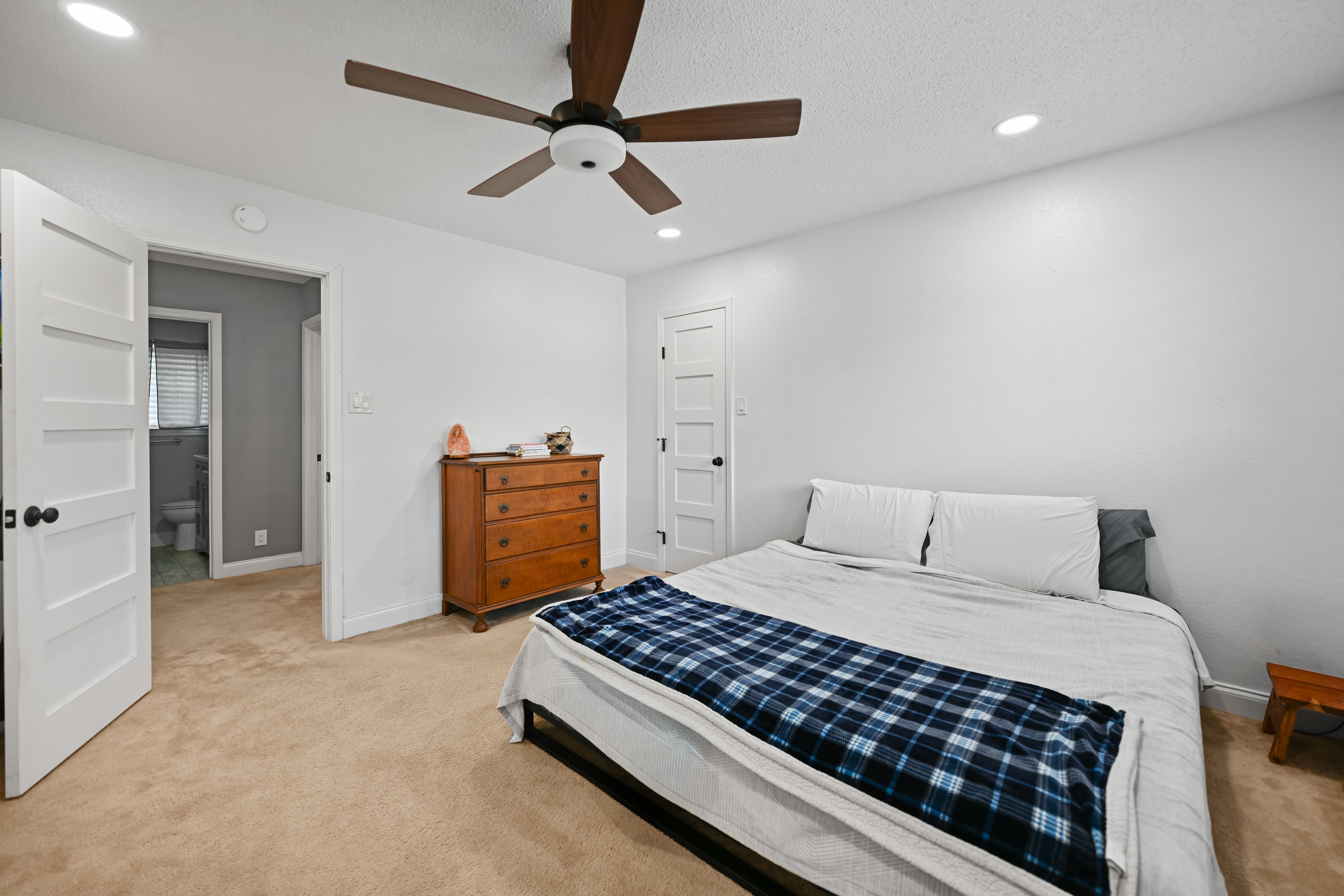8710 Clearbrook Trail Austin, TX 78729 - Photo 11 of 28 a bedroom with a bed and a walk in closet