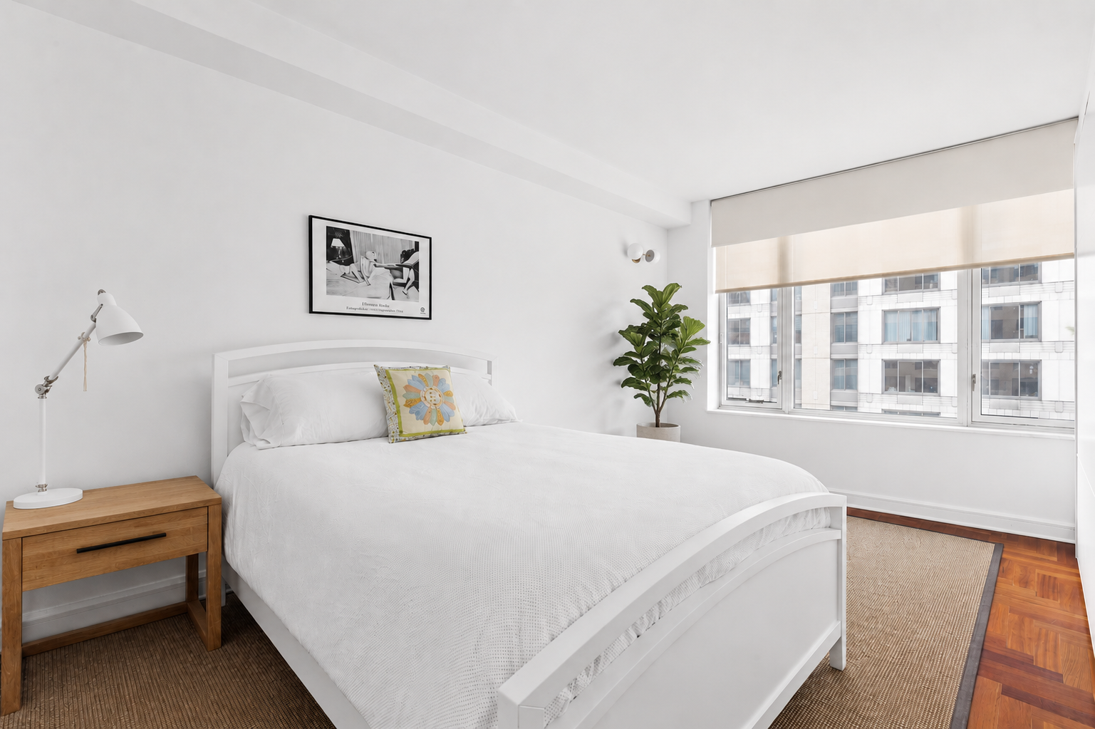 220 Riverside Boulevard, Unit 7G Manhattan, NY 10069 - Photo 4 of 11 a bedroom with a bed and a window