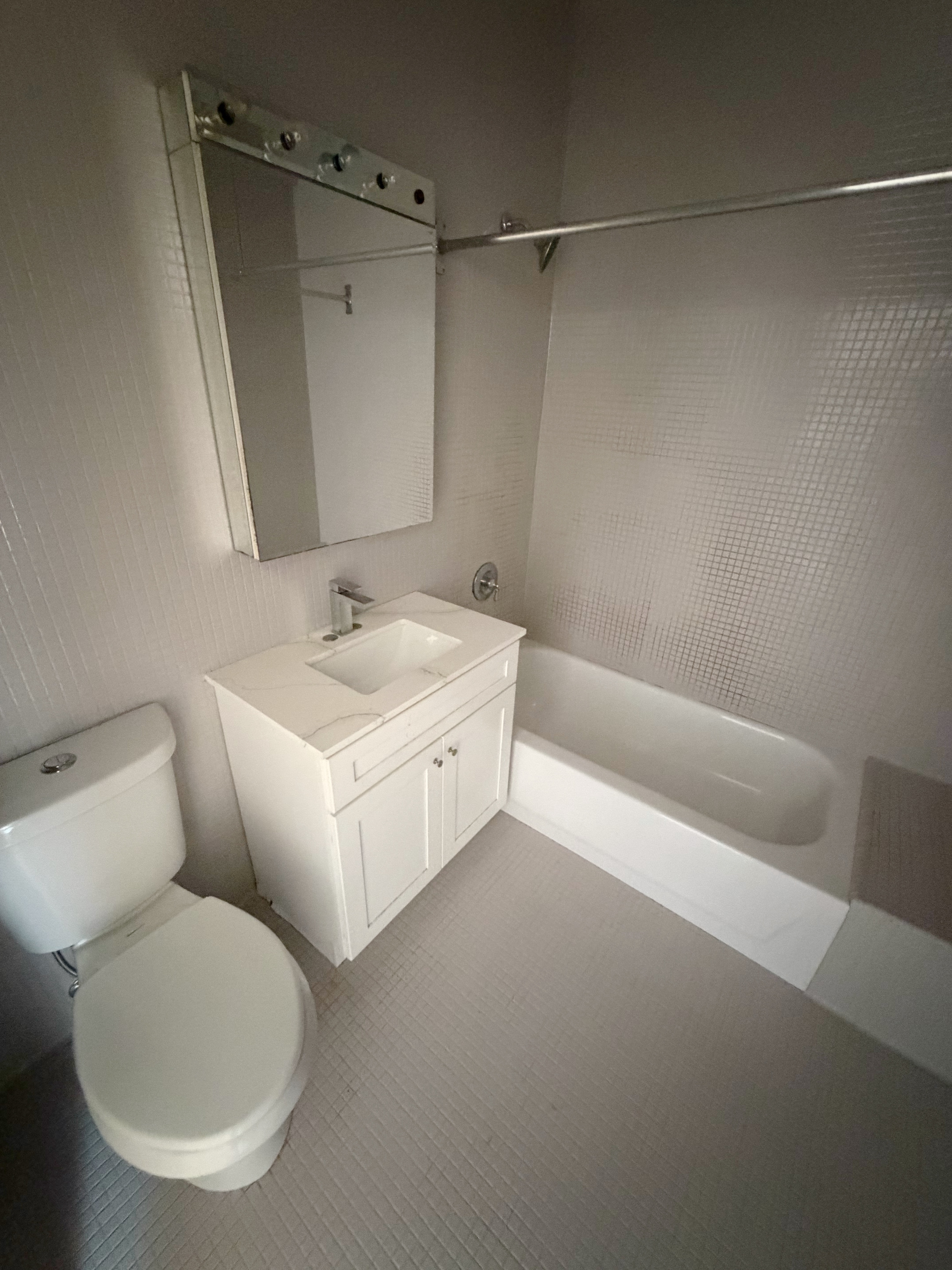 23 West 127th Street, Unit 3 Manhattan, NY 10027 - Photo 9 of 11 a bathroom with a sink and a mirror