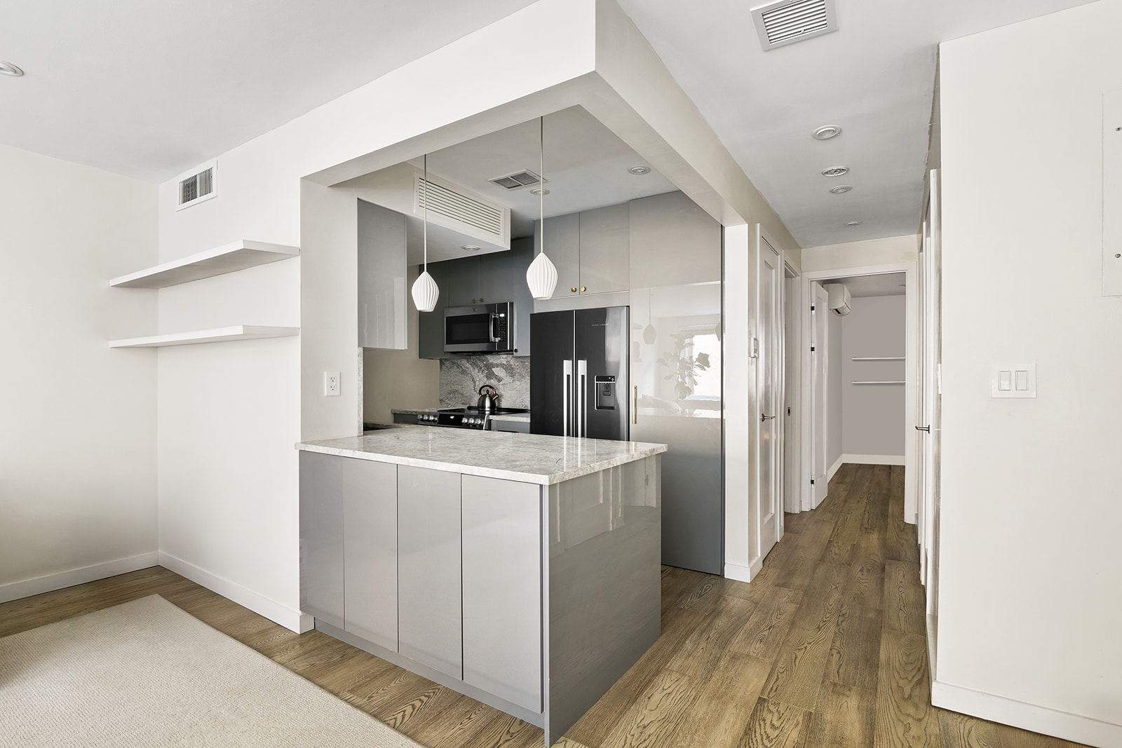 712 Washington Street, Unit 2A Manhattan, NY 10014 - Photo 3 of 8 a view of a kitchen cabinets and wooden floor