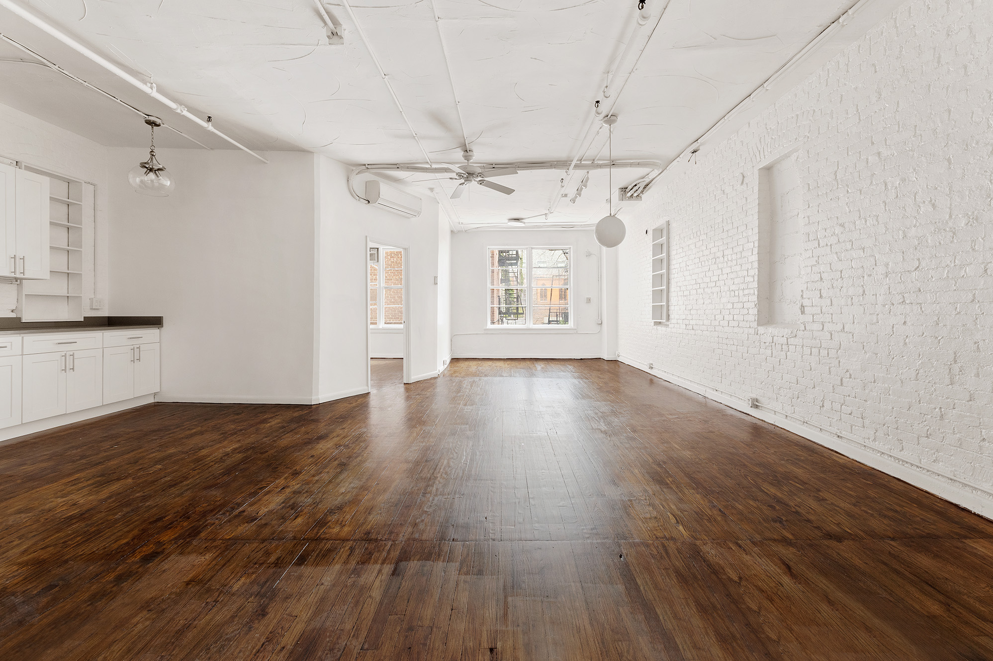 71 8th Avenue, Unit 3R Manhattan, NY 10014 - Photo 2 of 6 a view of a livingroom with wooden floor