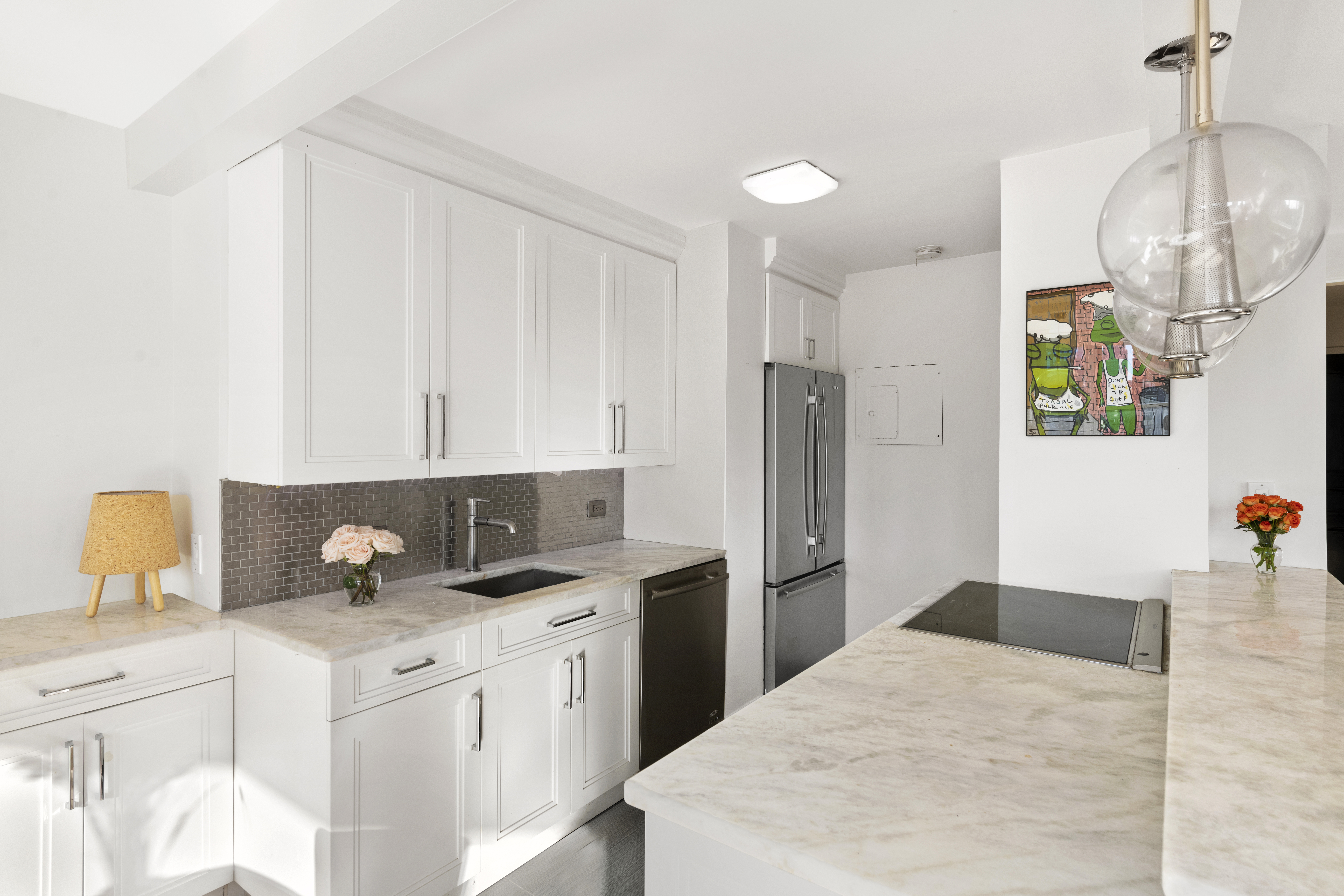 137 East 36th Street, Unit 21F Manhattan, NY 10016 - Photo 7 of 20 a kitchen with a sink dishwasher and a refrigerator