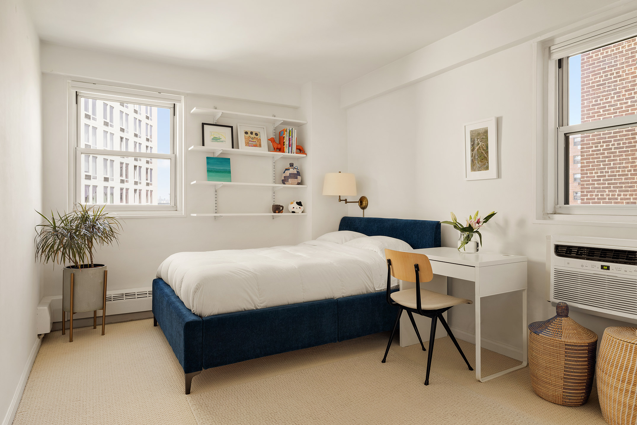 175 Willoughby Street, Unit 11L Brooklyn, NY 11201 - Photo 6 of 16 a bedroom with a bed table chair and window