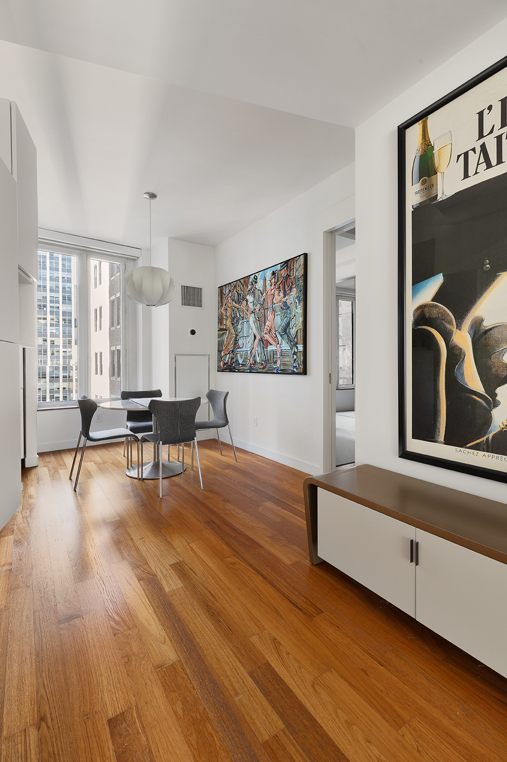 15 William Street, Unit 22H Manhattan, NY 10005 - Photo 2 of 20 a living room with furniture and a wooden floor