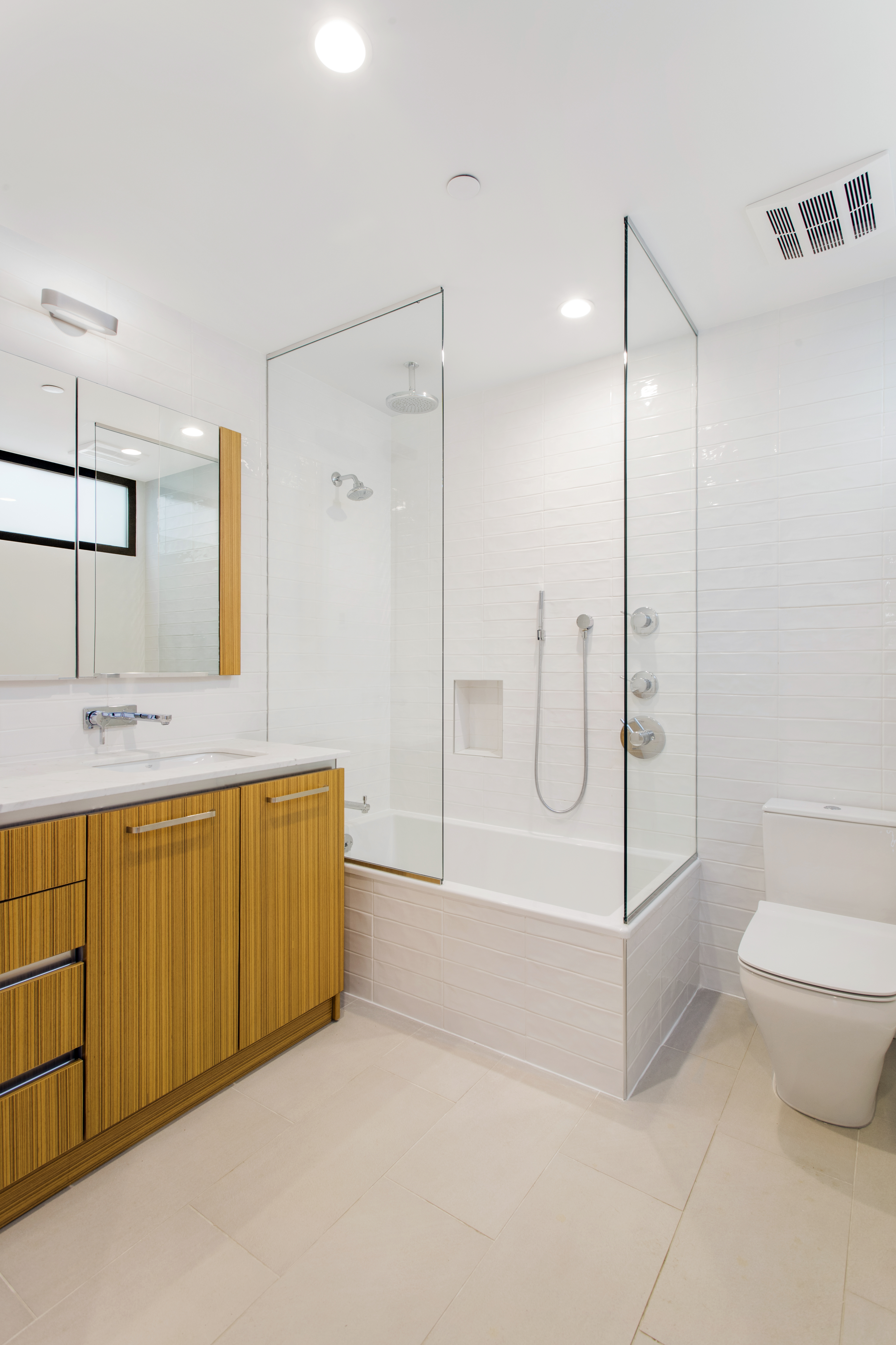 785 Hart Street, Unit THB Brooklyn, NY 11237 - Photo 12 of 15 a bathroom with a double vanity sink toilet and shower