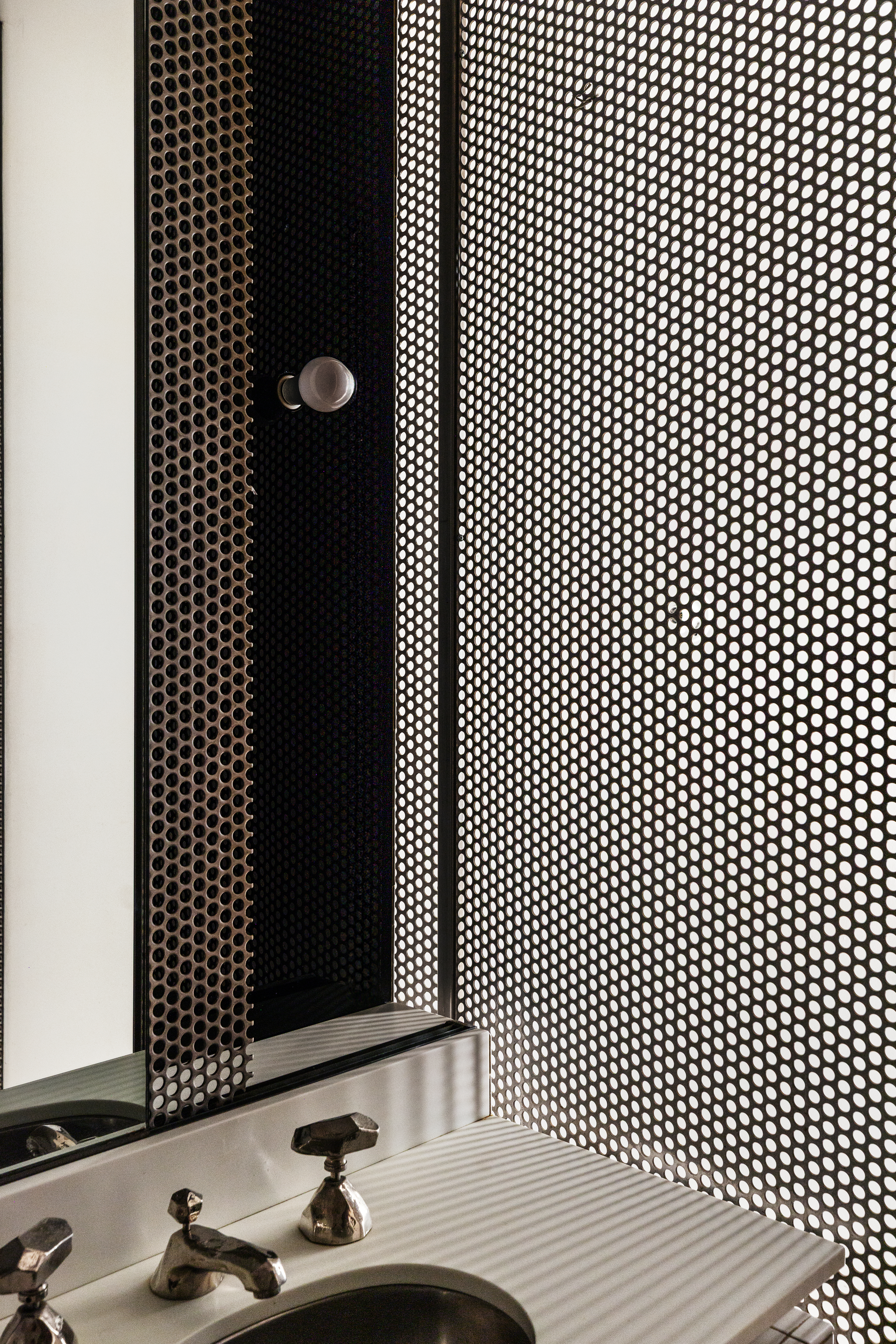 515 Broadway, Unit 4B Manhattan, NY 10012 - Photo 12 of 13 a bathroom with a sink and a mirror