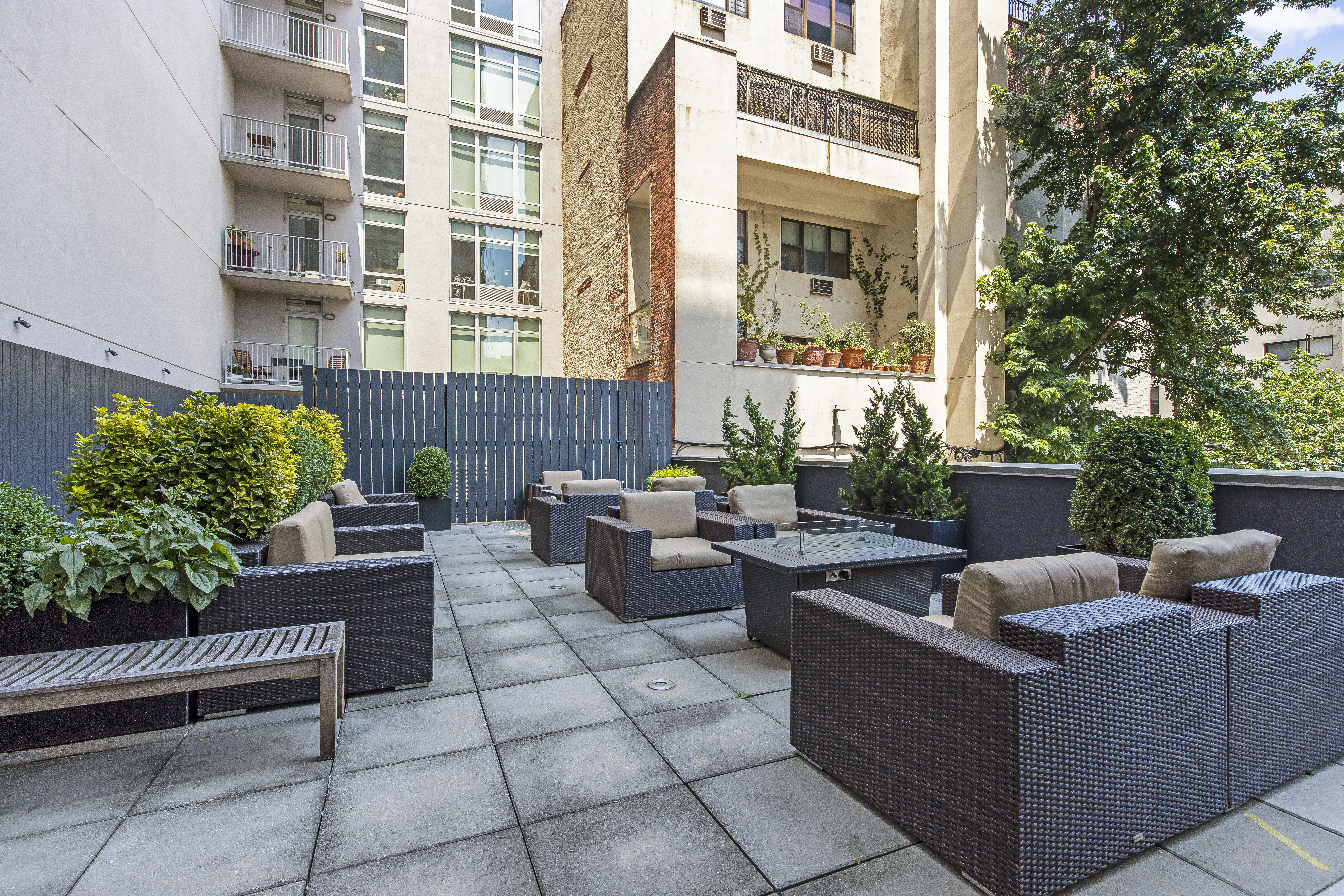 267 6th Street, Unit 2E Brooklyn, NY 11215 - Photo 8 of 13 a view of a patio with couches and a potted plant on a table