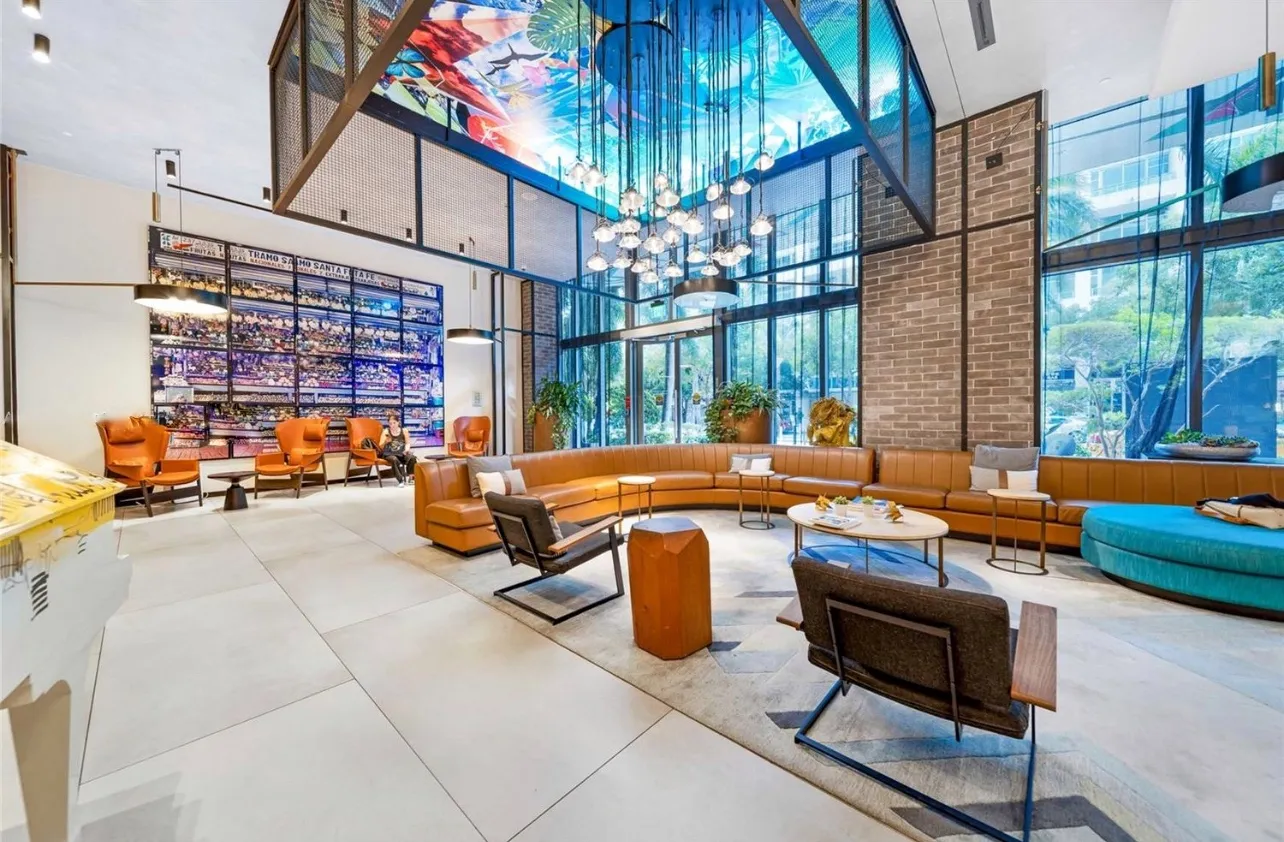 a backyard of a house with barbeque oven table and chairs