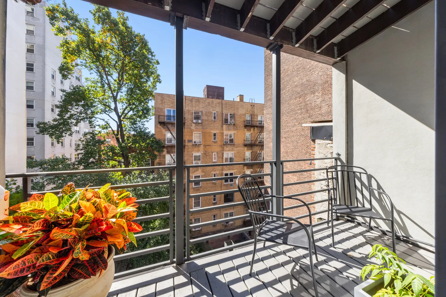 a kitchen with granite countertop a table chairs stove and sink