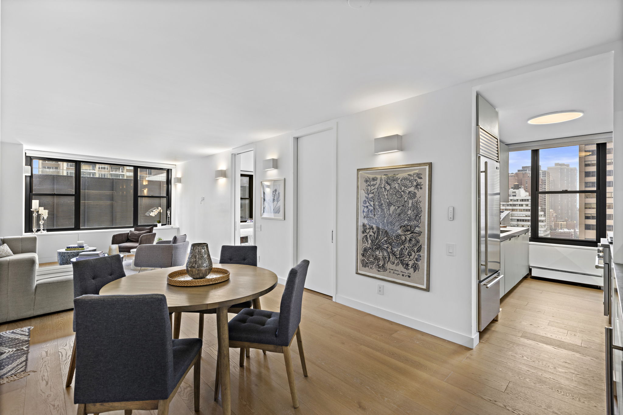 117 East 57th Street, Unit 21H Manhattan, NY 10022 - Photo 1 of 26 a view of a livingroom with furniture and window