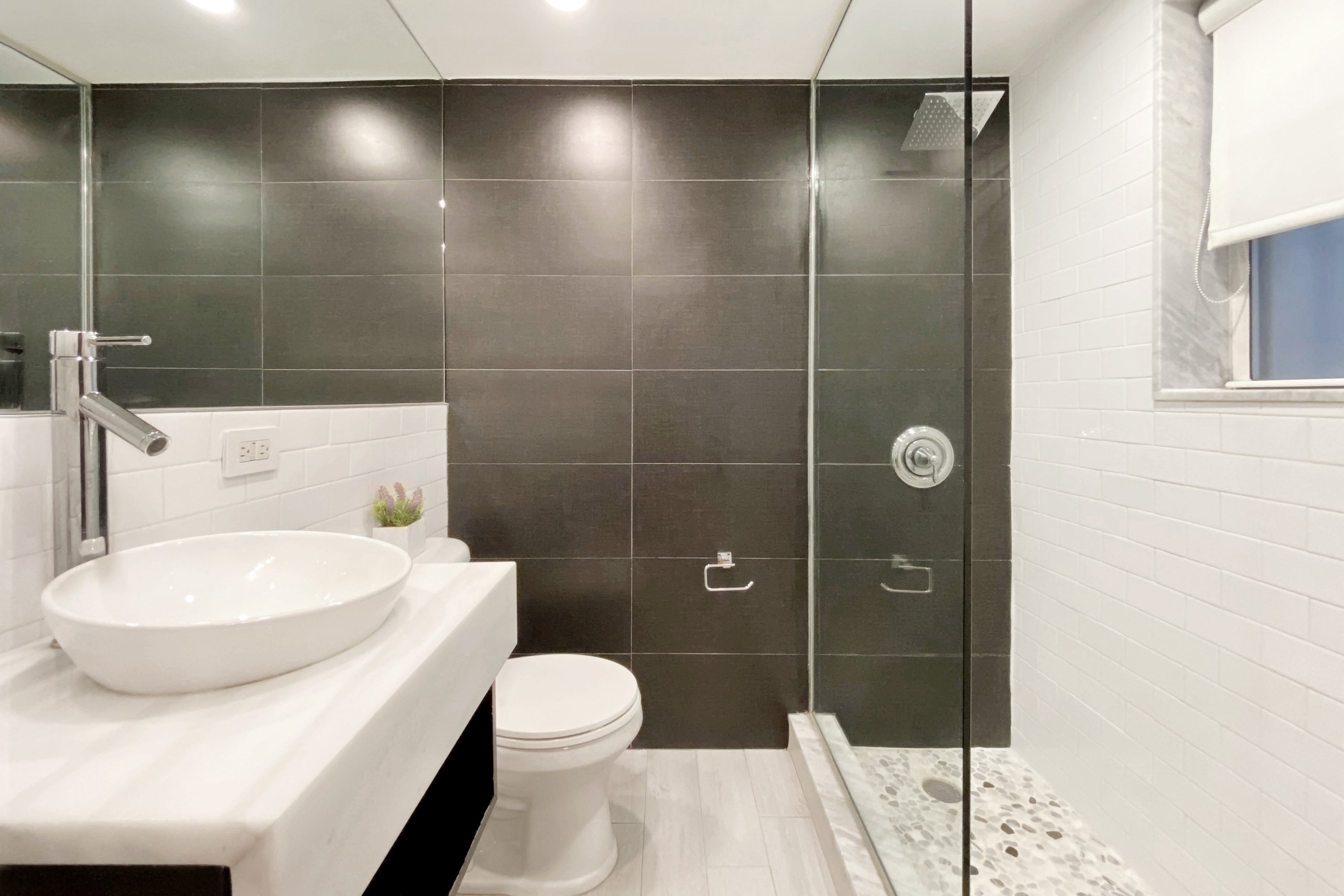 155 East 49th Street, Unit 1E Manhattan, NY 10017 - Photo 6 of 8 a bathroom with a toilet and a shower