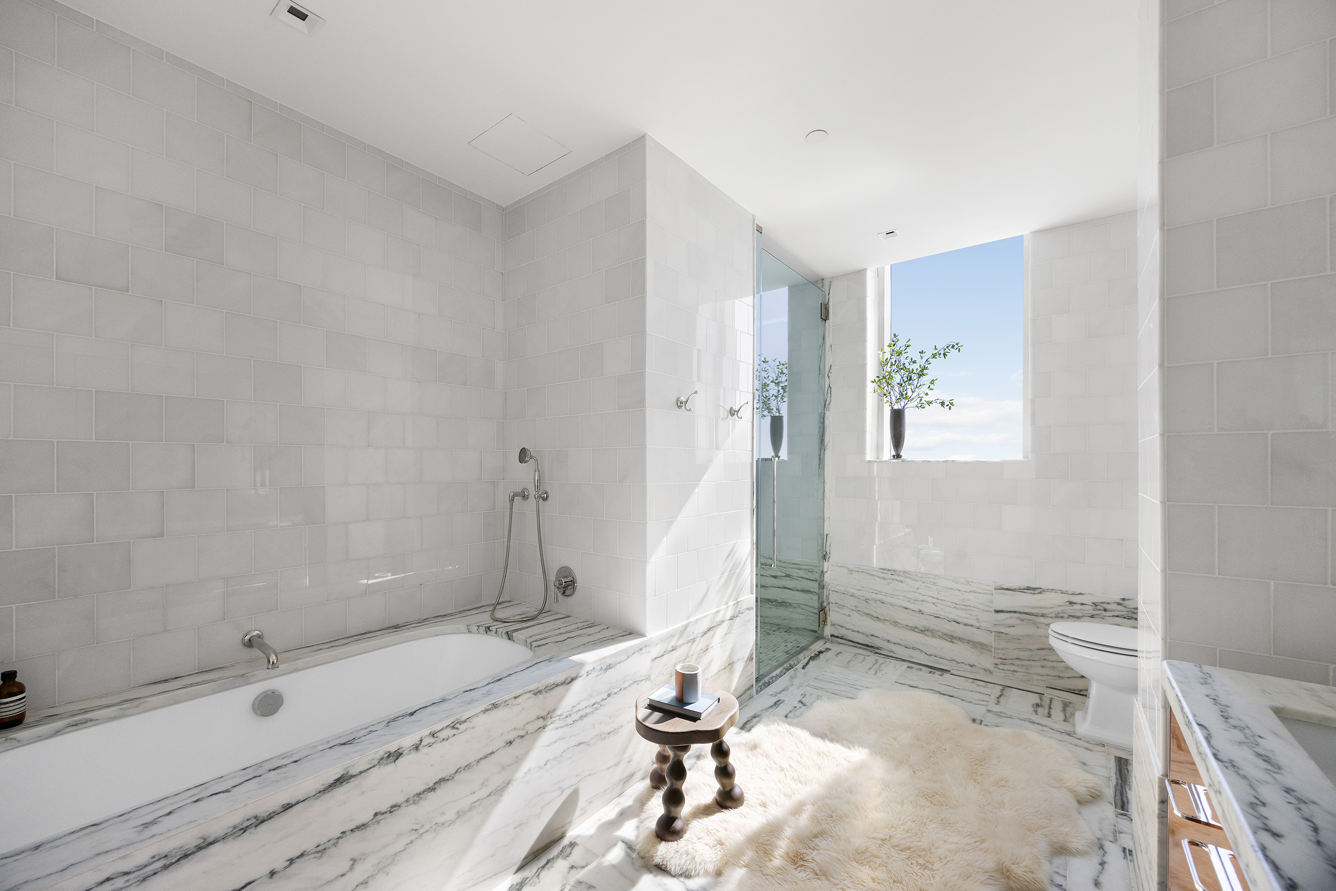 45 East 22nd Street, Unit 32B Manhattan, NY 10010 - Photo 26 of 36 a bathroom with a tub a sink and a shower
