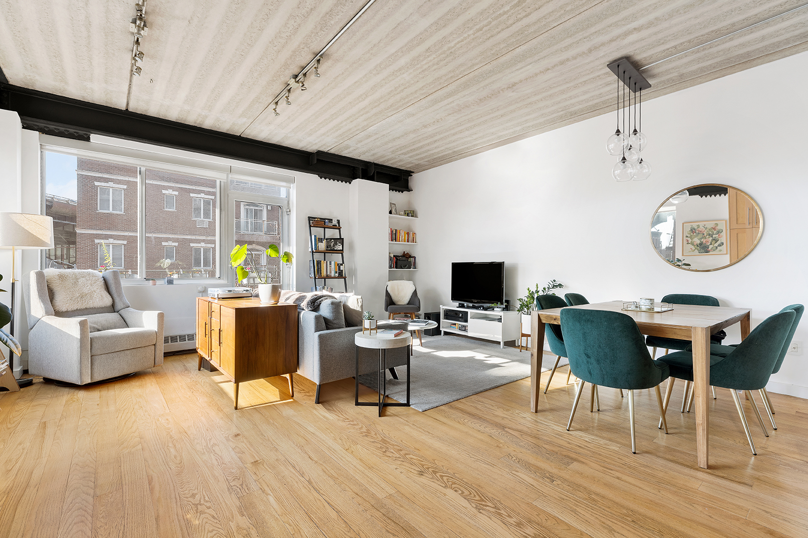 529 Court Street, Unit 204 Brooklyn, NY 11231 - Photo 2 of 9 a living room with furniture and a flat screen tv