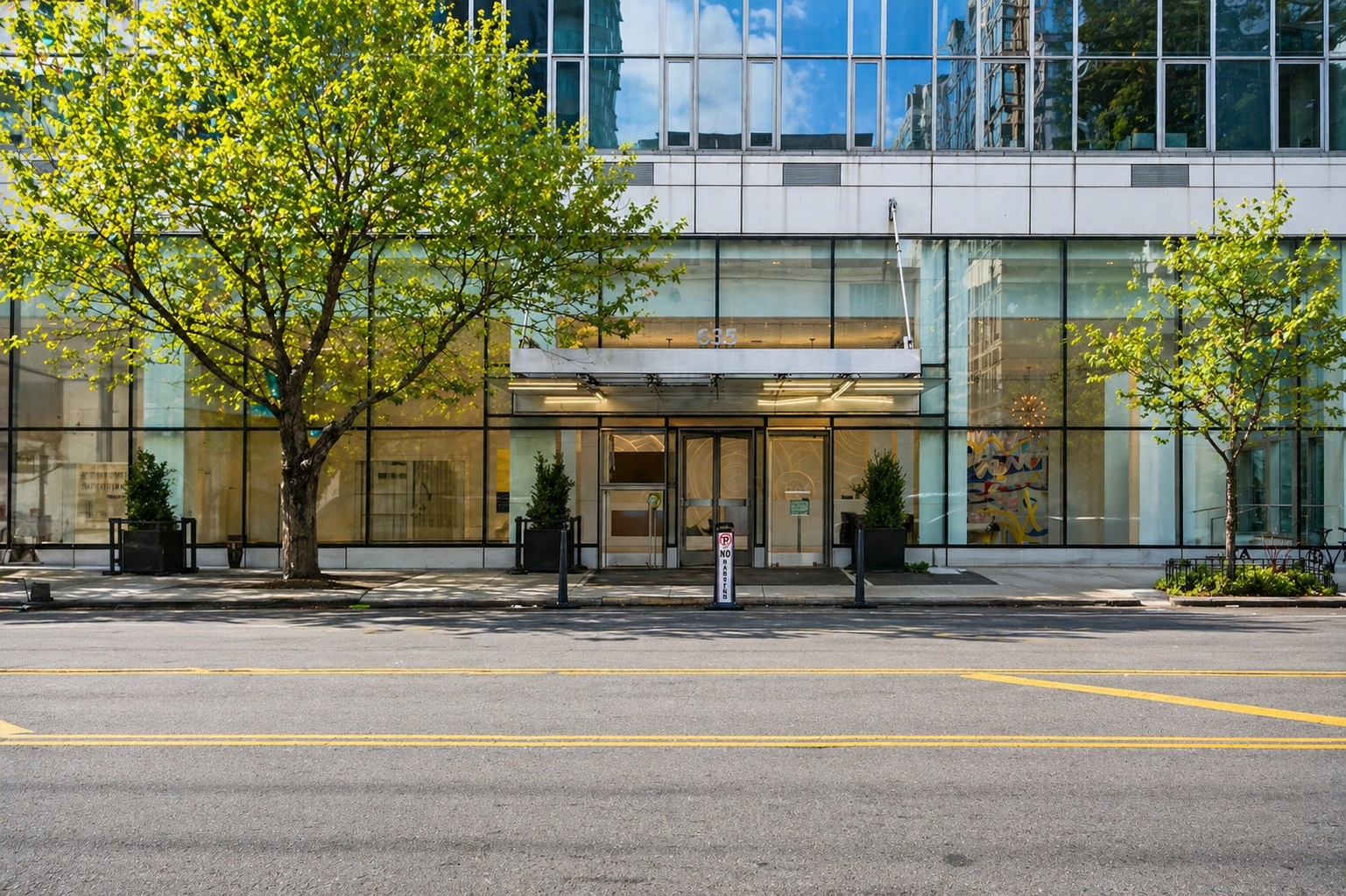 635 West 42nd Street, Unit 23E Manhattan, NY 10036 - Photo 19 of 26 a view of a building with car parked