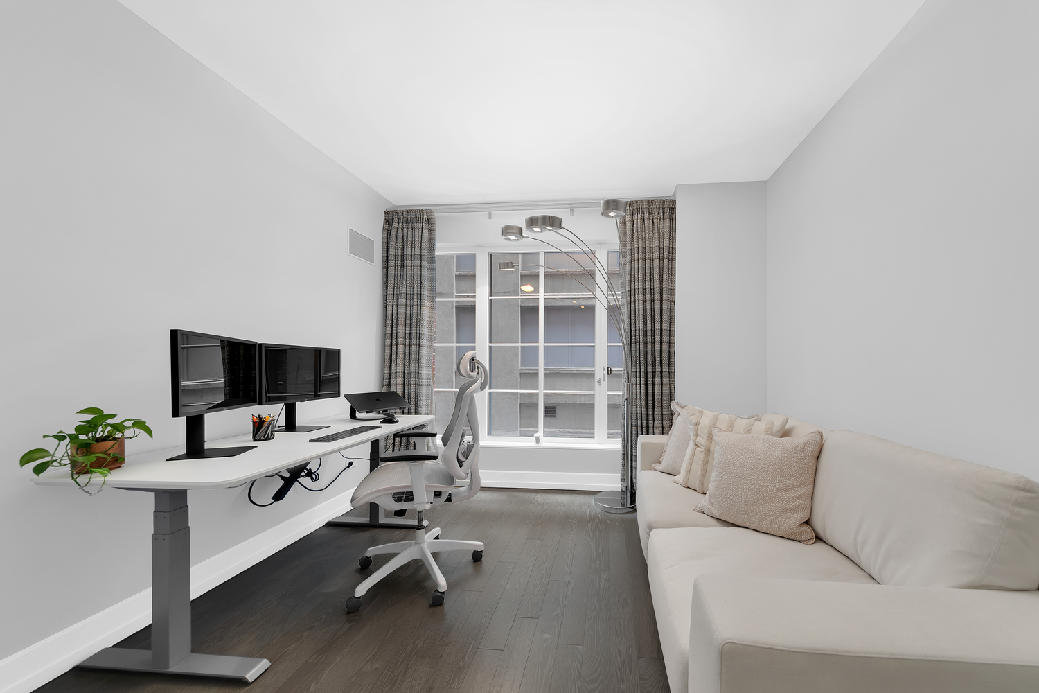 70 Charlton Street, Unit 3F Manhattan, NY 10014 - Photo 9 of 15 a workspace with furniture and a potted plant