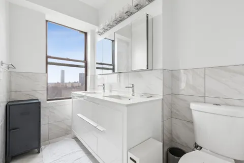 a bathroom with a sink toilet and tub