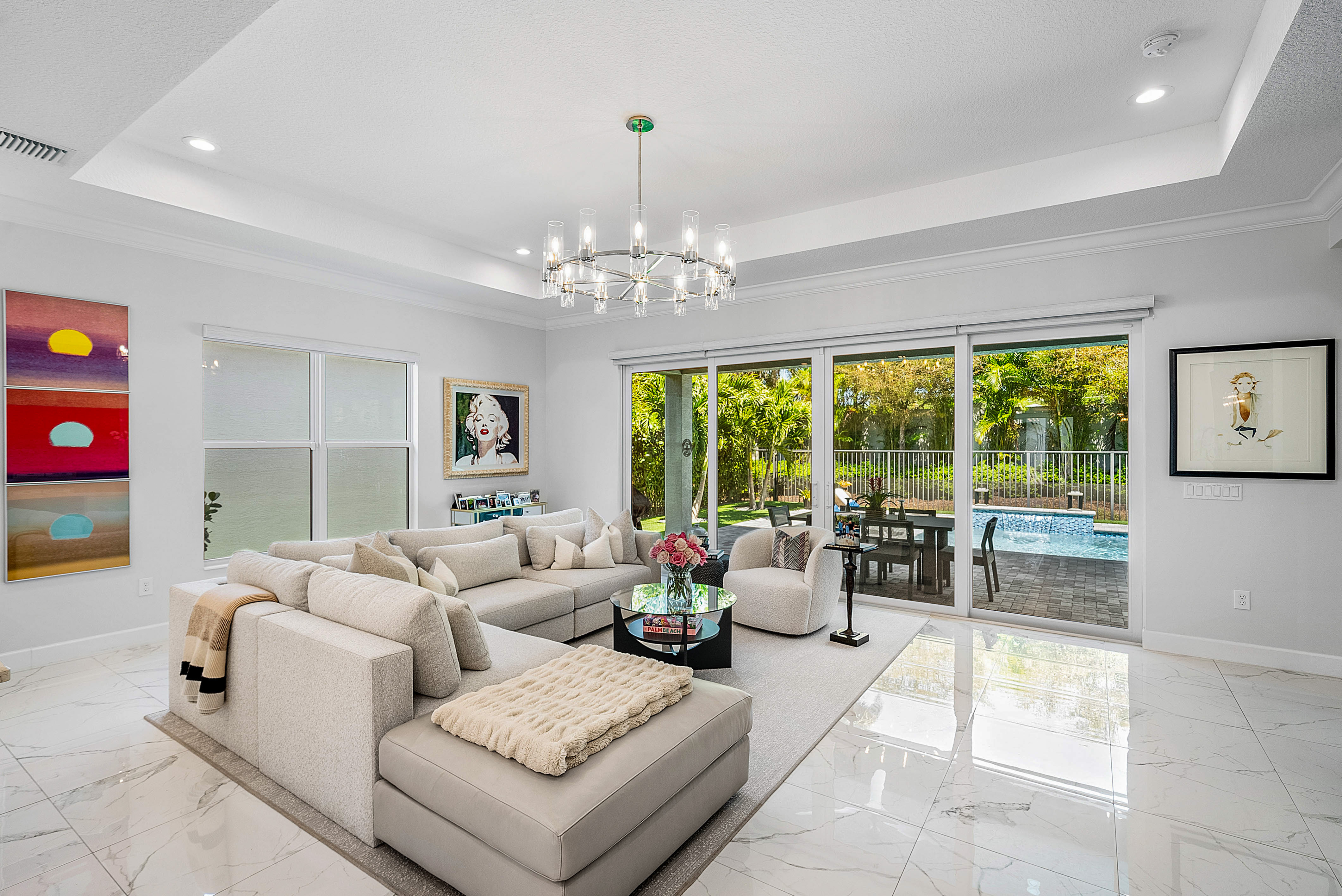 13172 Whistler Mountain Road Delray Beach, FL 33446 - Photo 11 of 38 a living room with furniture and a chandelier