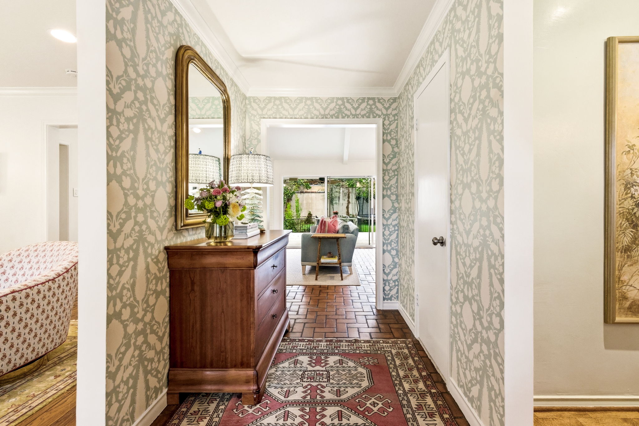 5765 Stonegate Road Dallas, TX 75209 - Photo 4 of 37 a living room with furniture and a floor to ceiling window