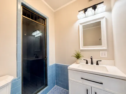 a bathroom with a bathtub and shower