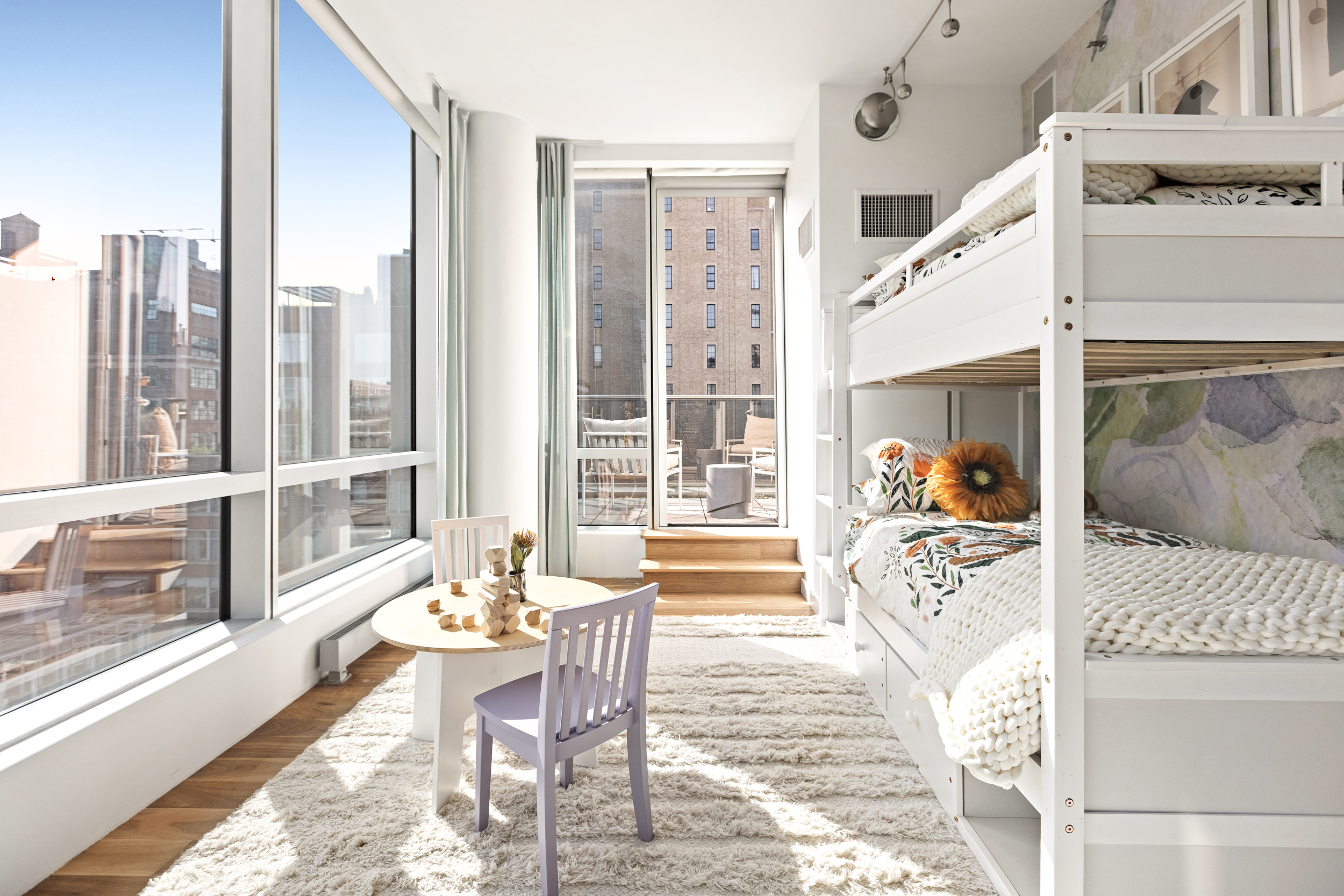 166 West 18th Street, Unit PH11 Manhattan, NY 10011 - Photo 10 of 16 a living room with furniture and a large window