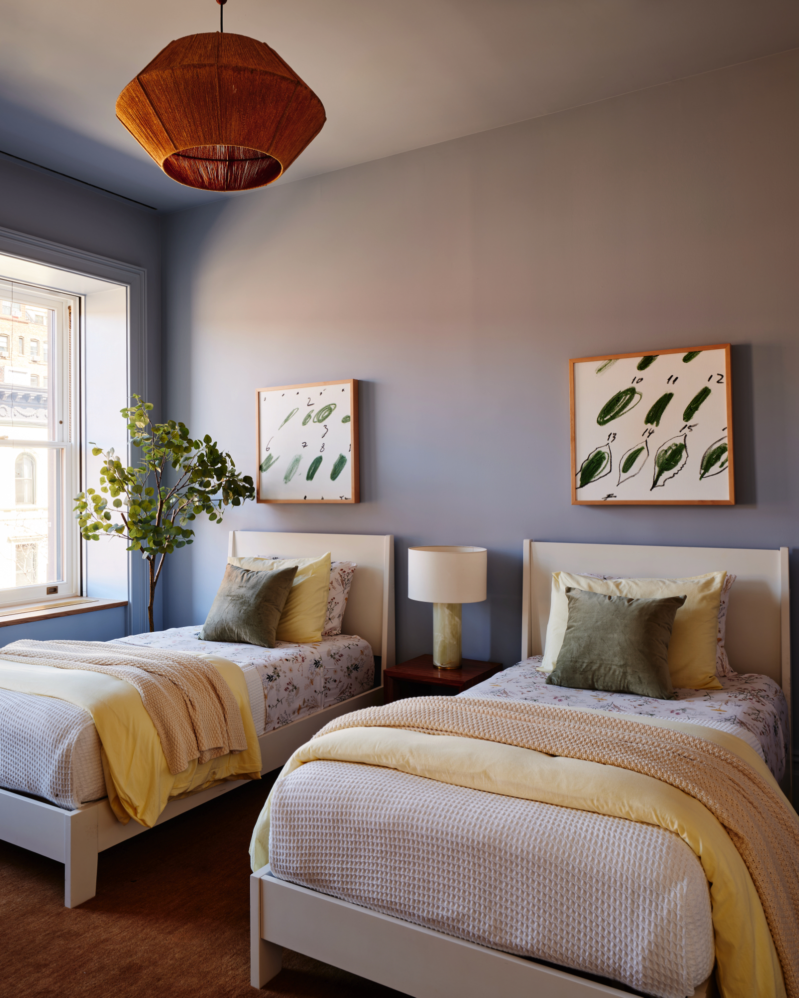 48-50 West 69th Street Manhattan, NY 10023 - Photo 17 of 33 a bedroom with two beds and a potted plant