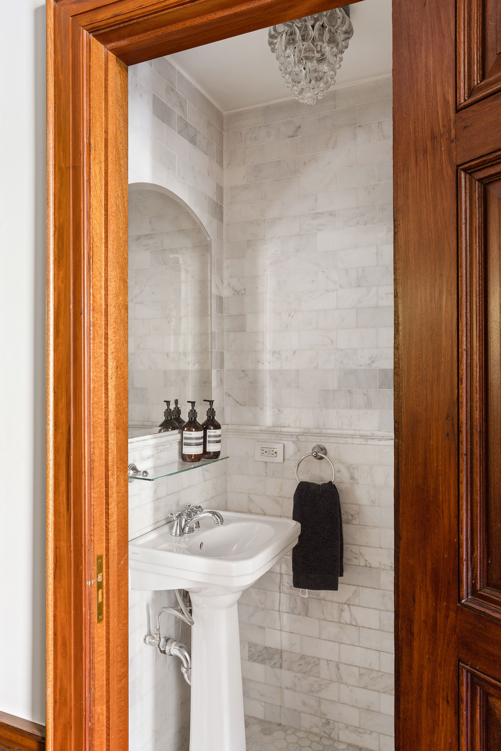 89 West 119th Street Manhattan, NY 10026 - Photo 16 of 22 a bathroom with a sink and a mirror