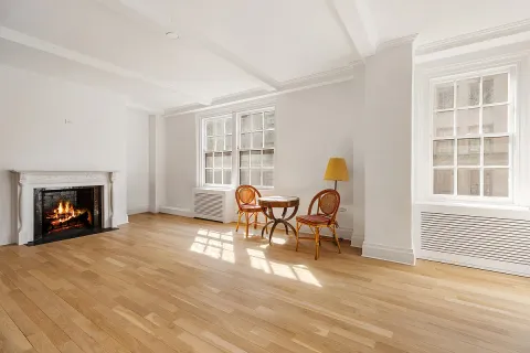 a dining room with furniture and a fireplace
