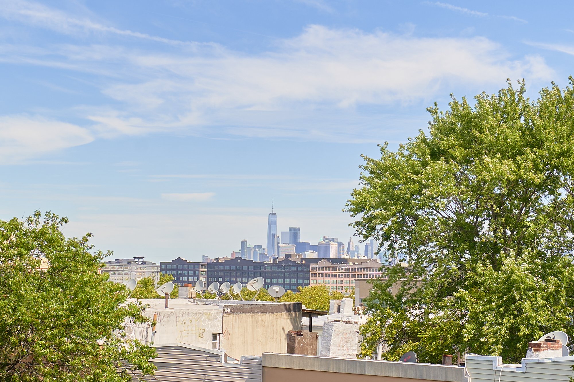 4802 4th Avenue, Unit 3R Brooklyn, NY 11220 - Photo 9 of 9 a view of a city with tall buildings in ocean