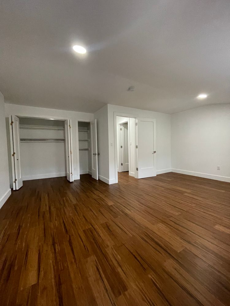 692 Putnam Avenue, Unit 2 Brooklyn, NY 11221 - Photo 11 of 15 a view of empty room with wooden floor and fan