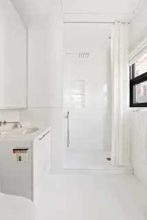 a bathroom with a sink and mirror
