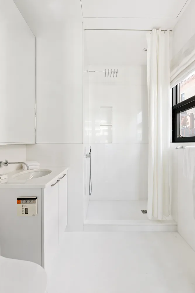 a bathroom with a sink and mirror