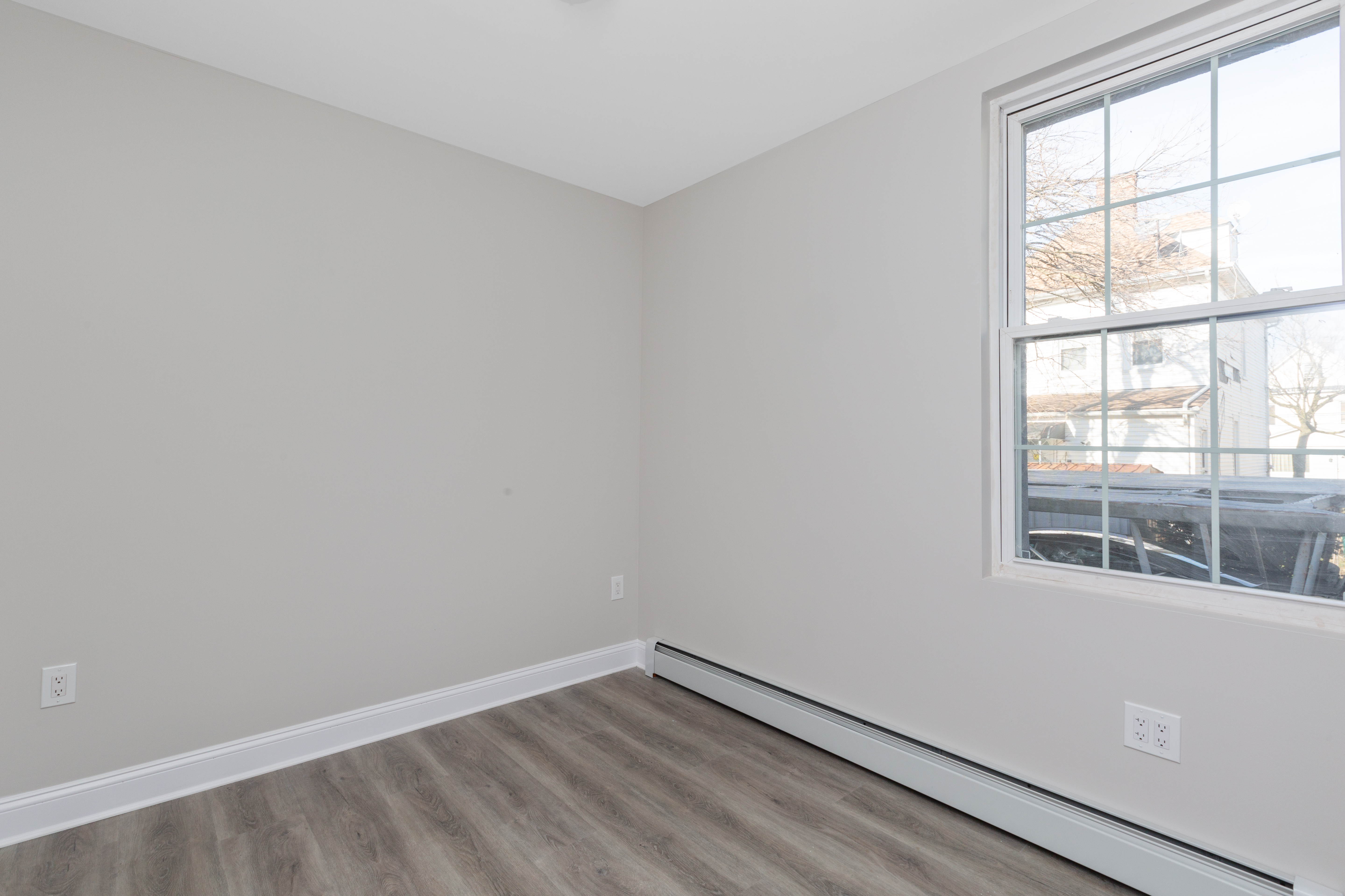 143-10 Shore Avenue Queens, NY 11435 - Photo 15 of 30 an empty room with a window