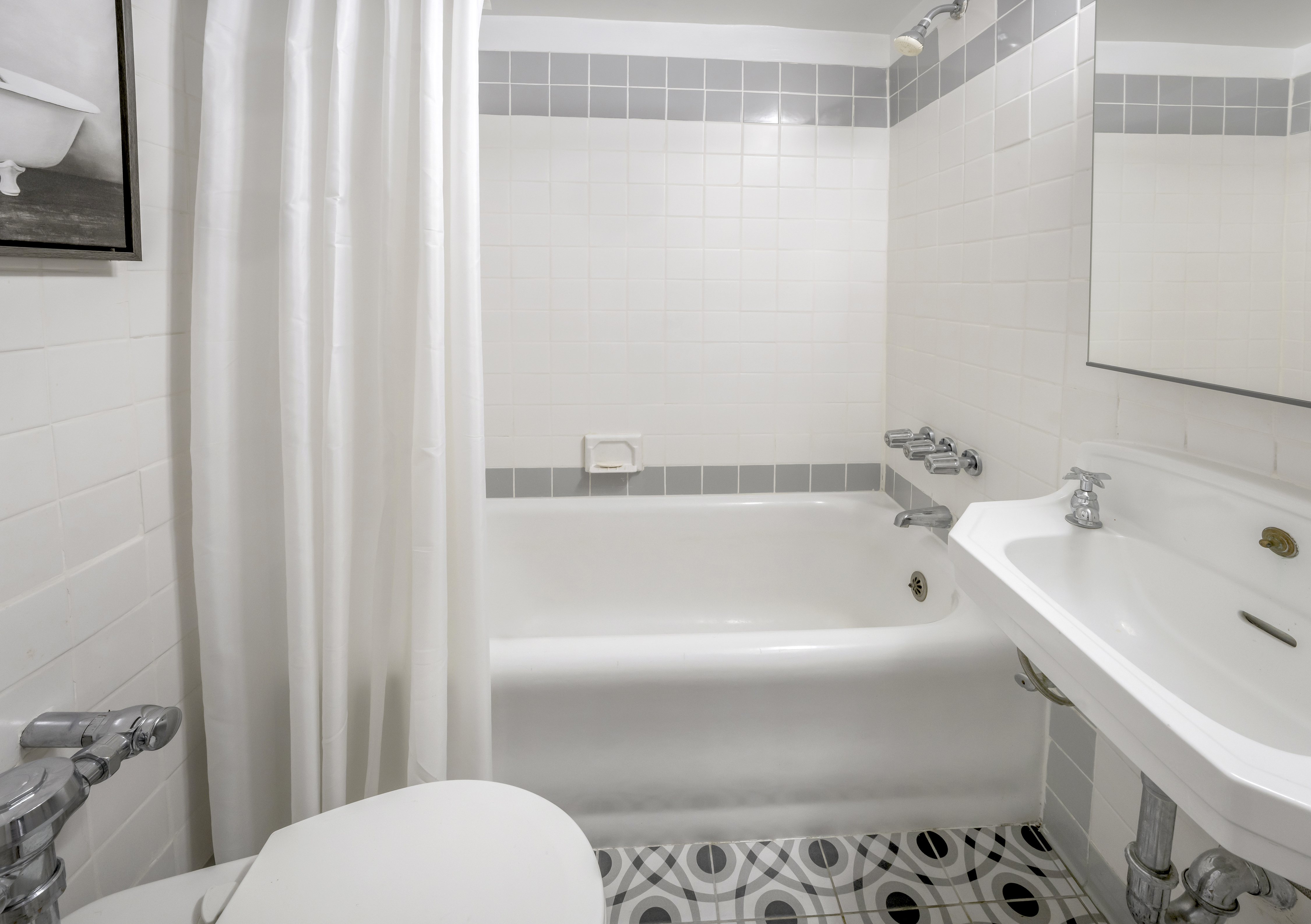 2166 Broadway, Unit 5C Manhattan, NY 10024 - Photo 7 of 11 a bathroom with a sink and a toilet