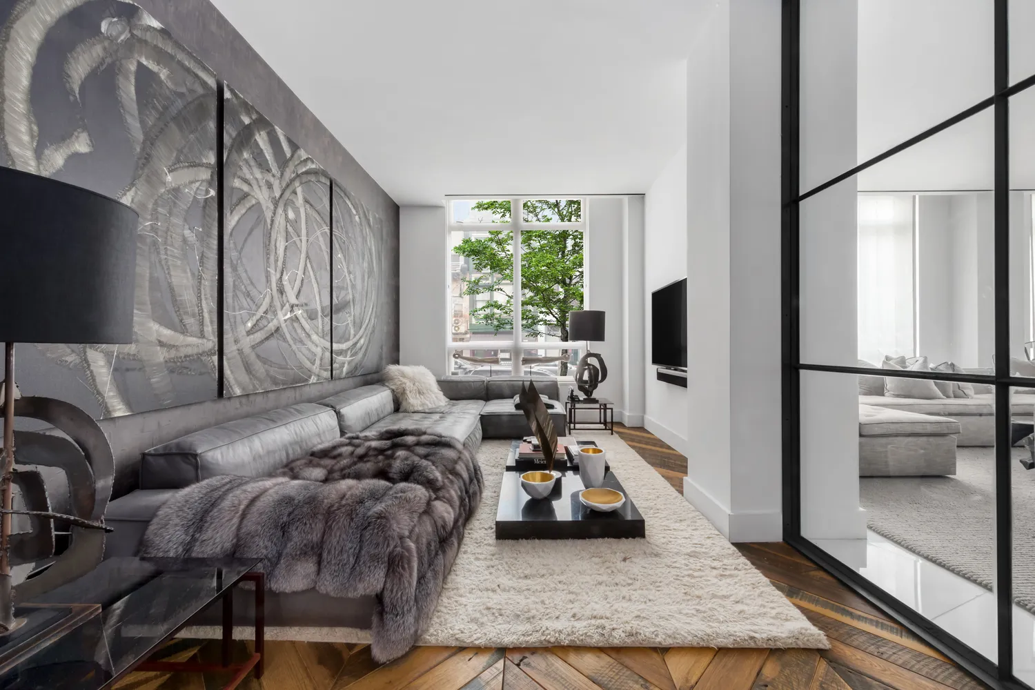 a living room with furniture and a flat screen tv