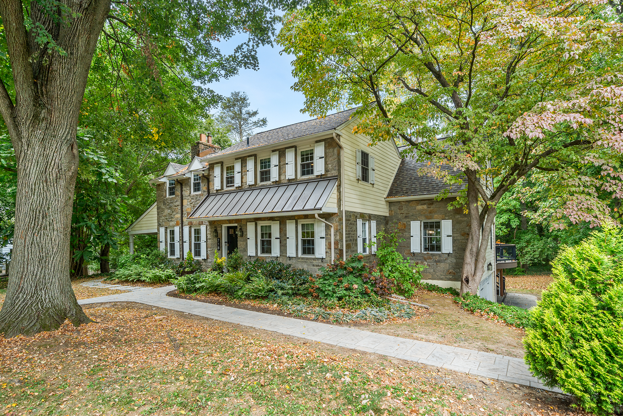 718 Arlington Road Narberth, PA 19072 - Photo 41 of 47 front view of a house with a garden