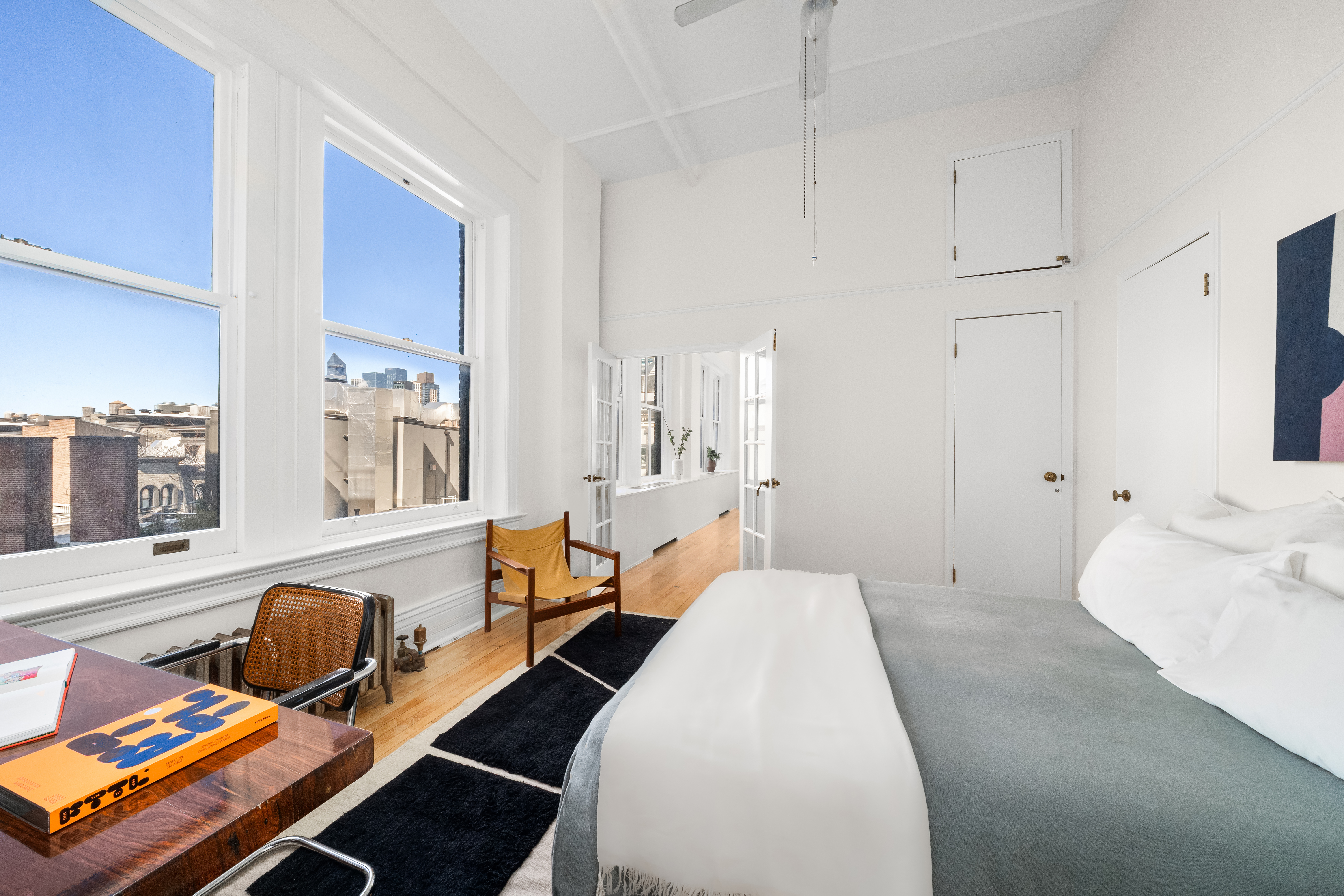 874 Broadway, Unit 907 Manhattan, NY 10003 - Photo 4 of 14 a bedroom with furniture and a window