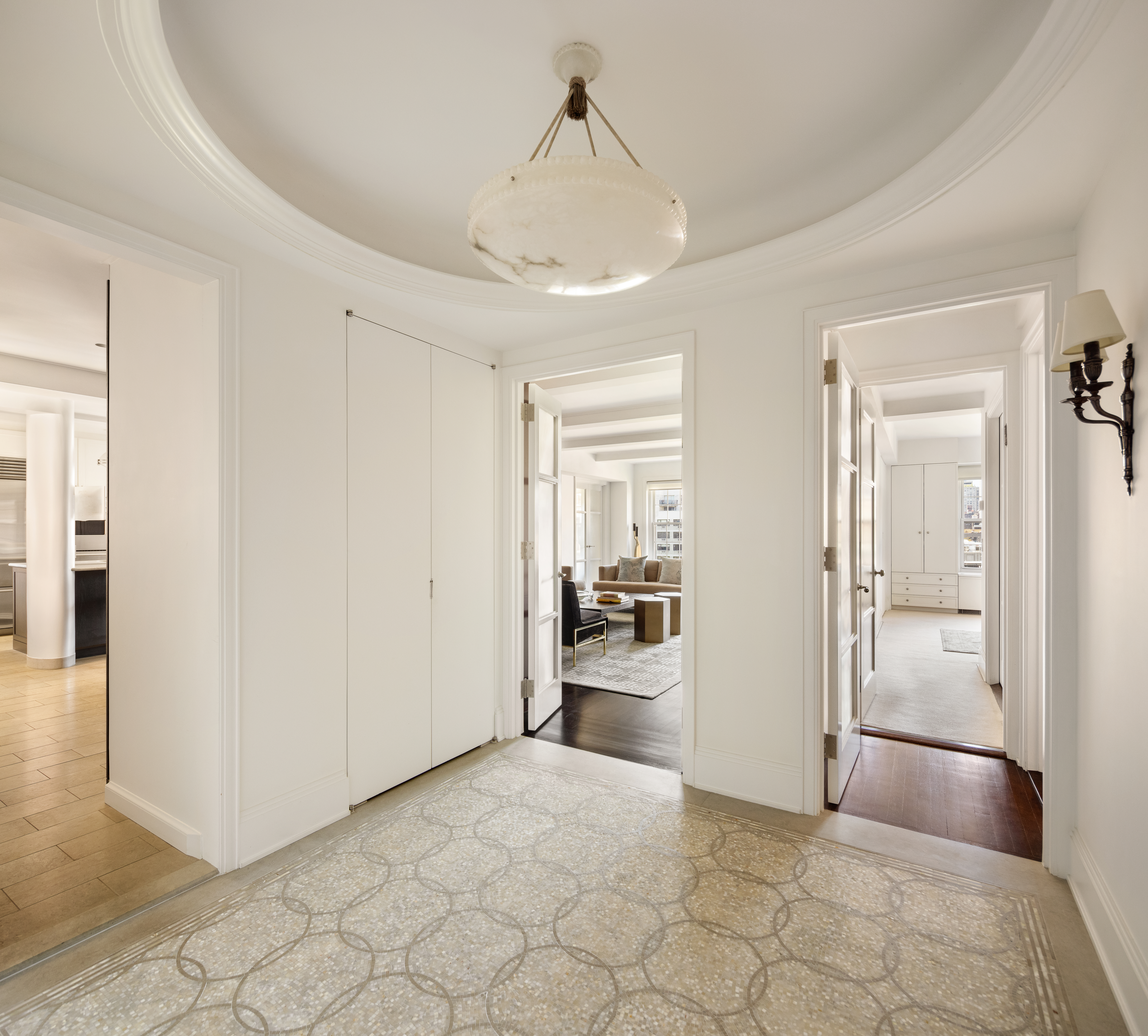 333 East 68th Street, Unit 8A Manhattan, NY 10065 - Photo 2 of 16 a view of a hallway with a livingroom and a bathroom