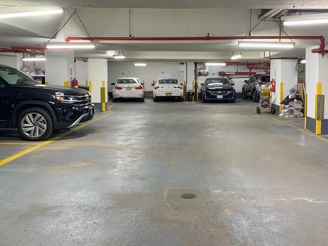 251 East 32nd Street, Unit 5J Manhattan, NY 10016 - Photo 10 of 15 a view of a garage with parked cars