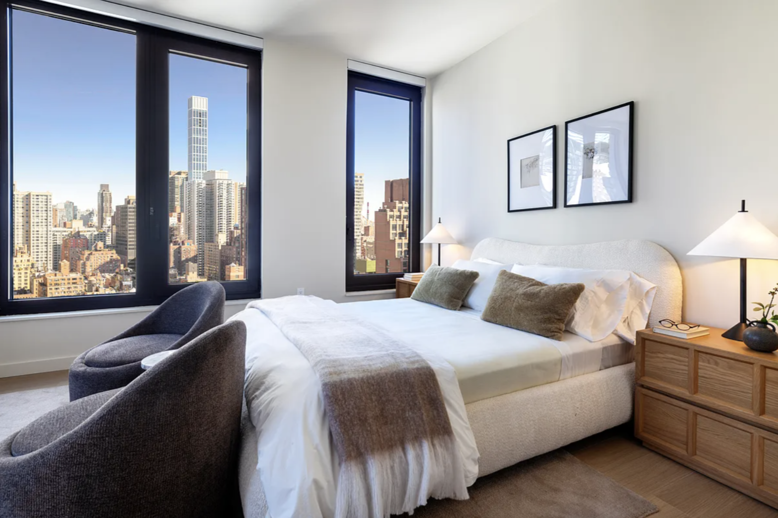 300 East 50th Street, Unit 18A Manhattan, NY 10022 - Photo 5 of 27 a bedroom with a bed and a large window