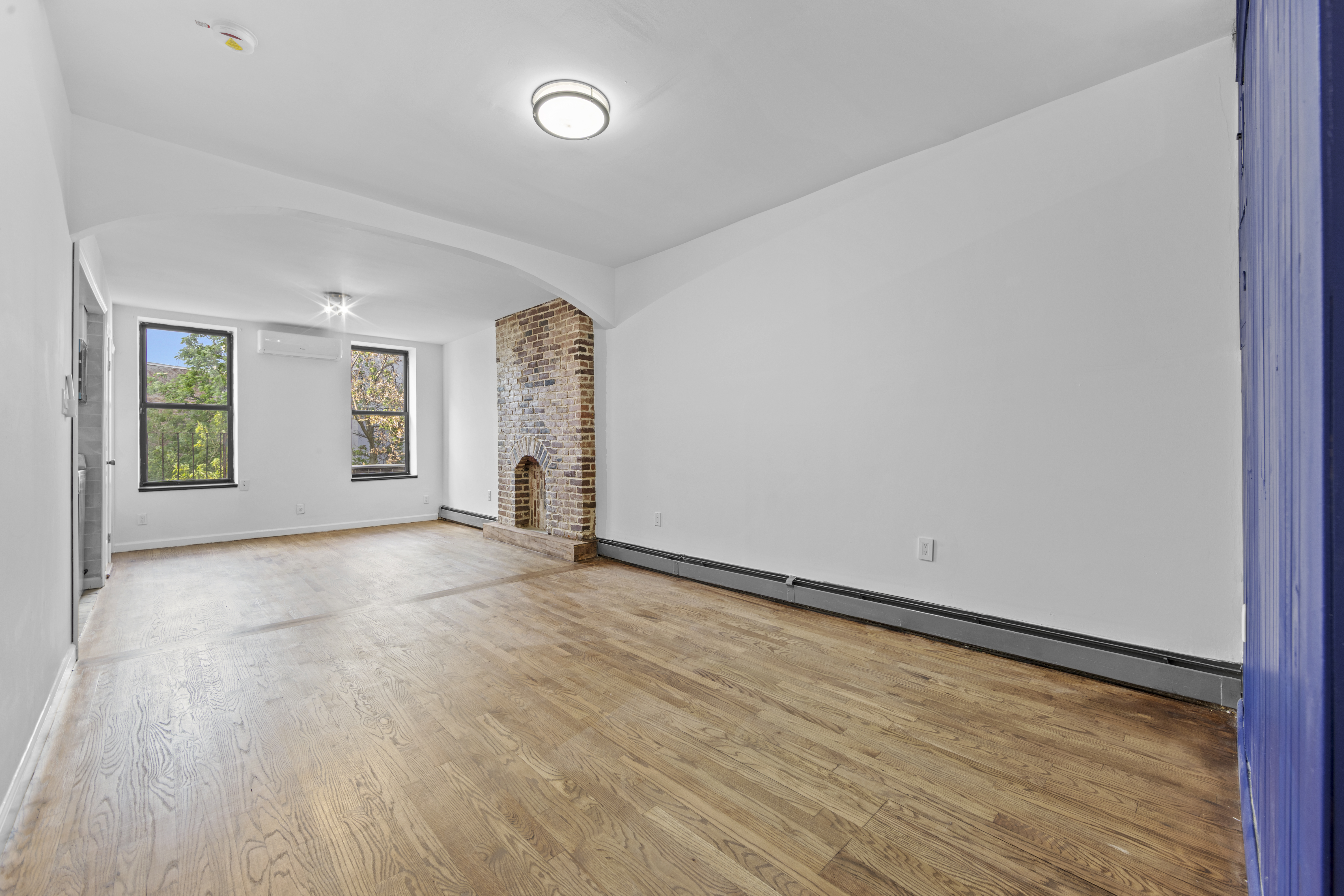 1061 Fulton Street, Unit 3 Brooklyn, NY 11238 - Photo 2 of 14 an empty room with windows and closet